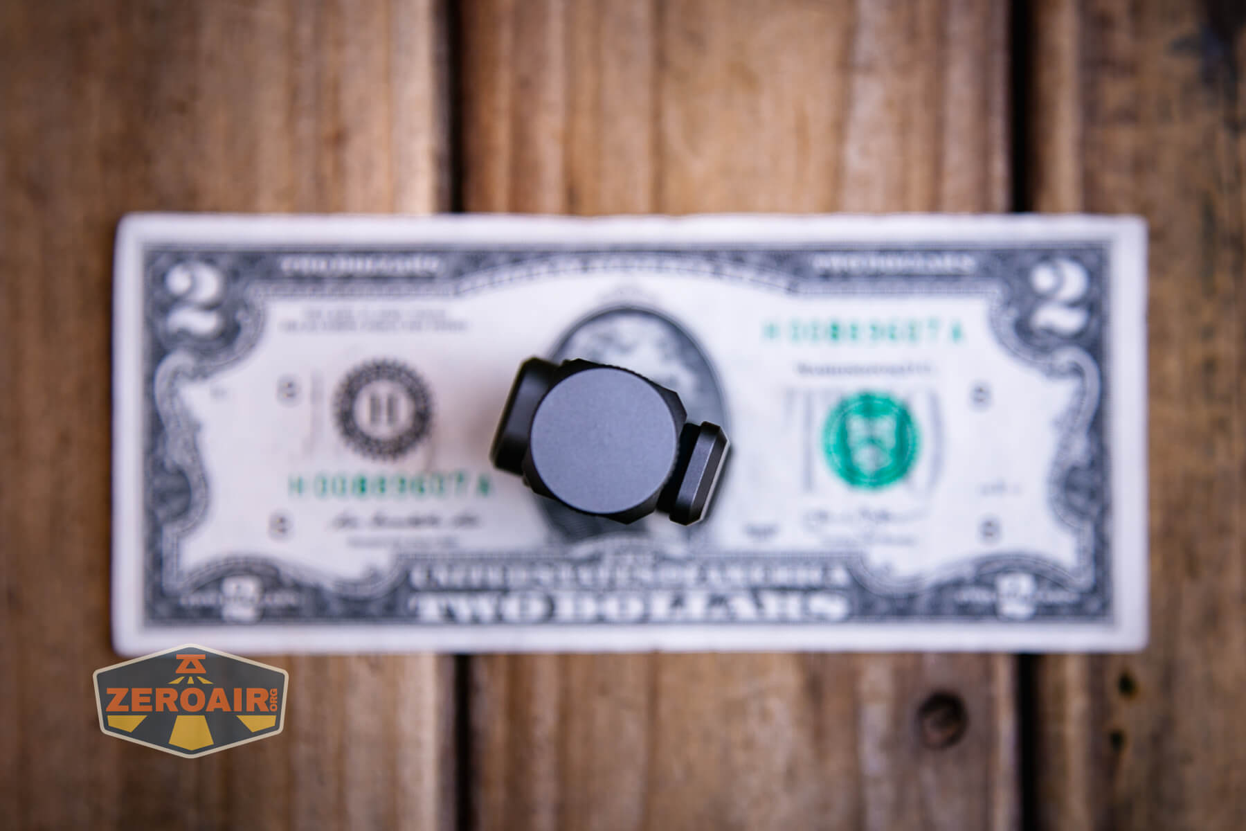 Sofirn ST10 Clip-on mini flashlight on two dollar bill
