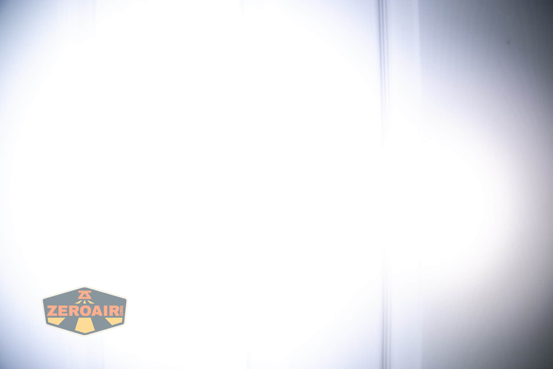 Sofirn ST10 Clip-on mini flashlight beamshots on door compared to nichia 219b