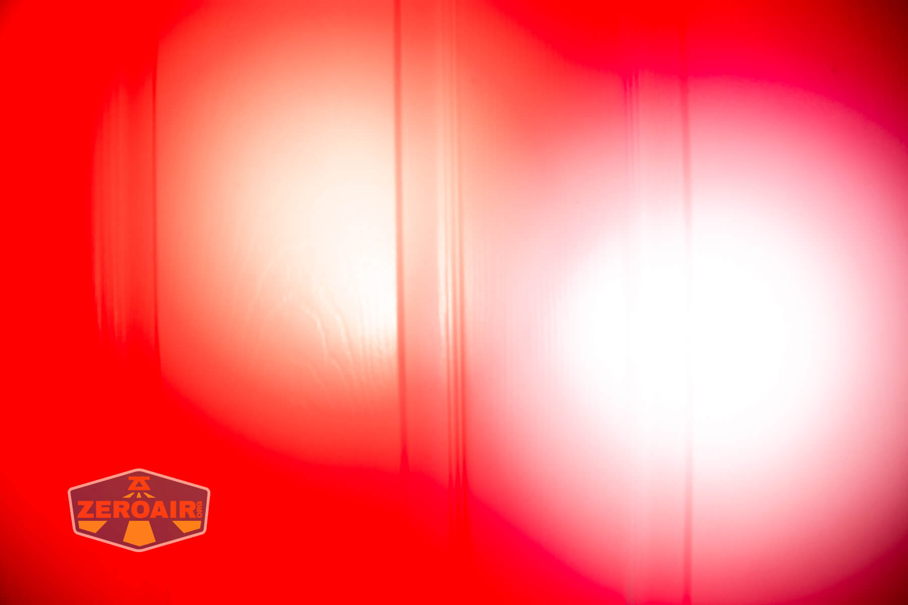 Sofirn ST10 Clip-on mini flashlight beamshots on door compared to nichia 219b