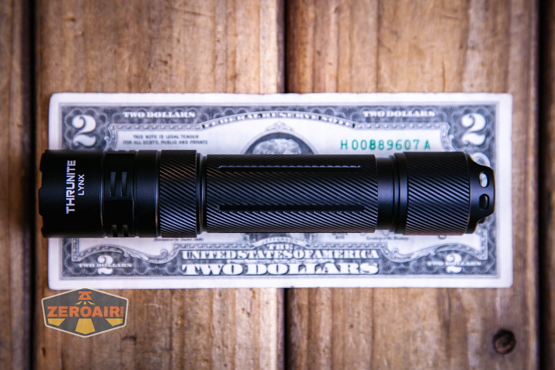 Thrunite Lynx flashlight on a two dollar bill