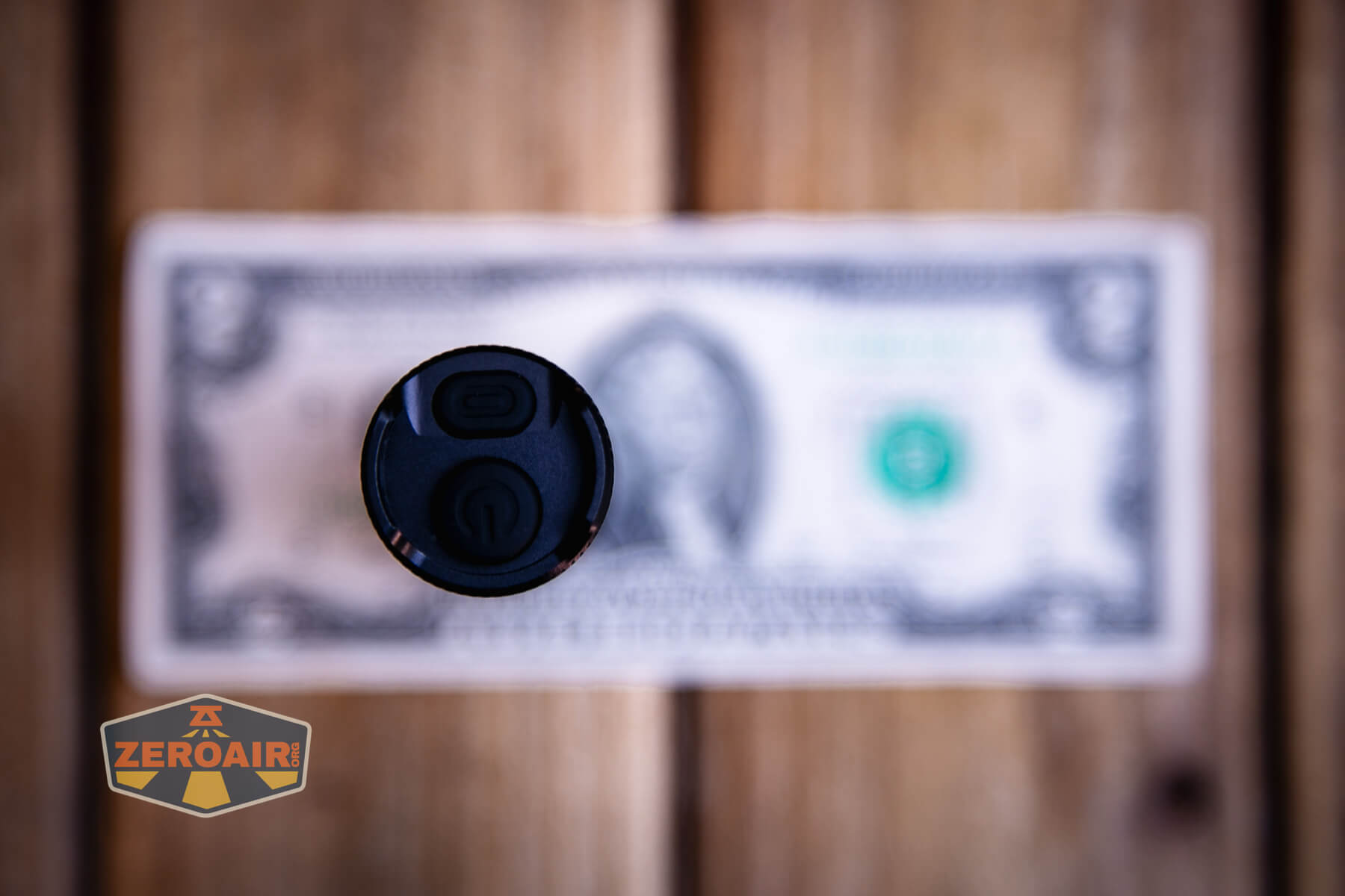 Thrunite Lynx flashlight on a two dollar bill