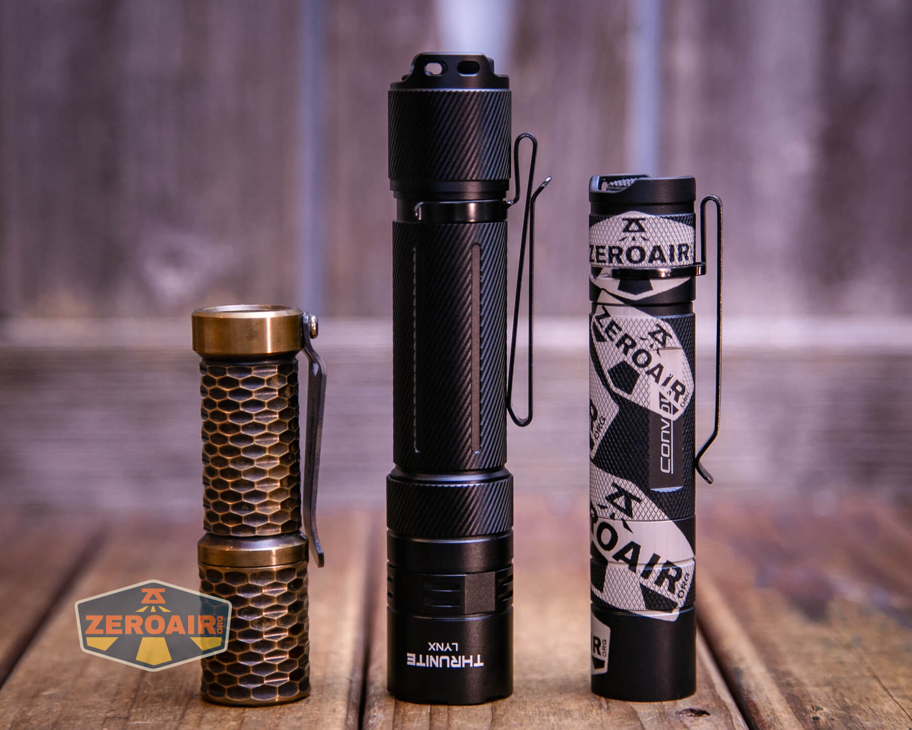 Thrunite Lynx flashlight with two standard sized flashlights