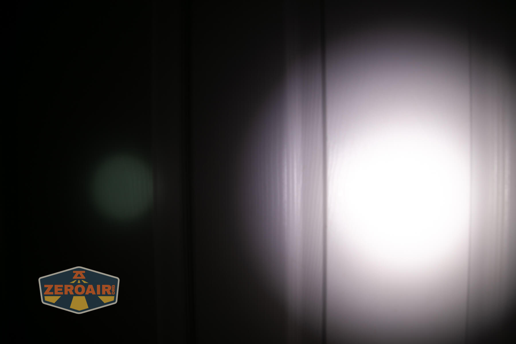 Thrunite Lynx flashlight beamshots on door (at 1') compared to nichia 219b 4500K