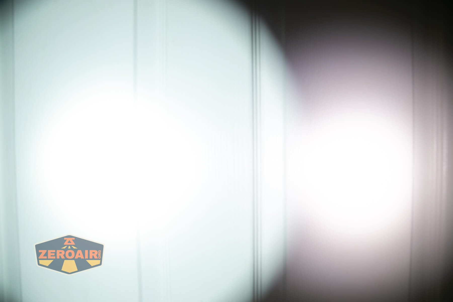 Thrunite Lynx flashlight beamshots on door (at 1') compared to nichia 219b 4500K