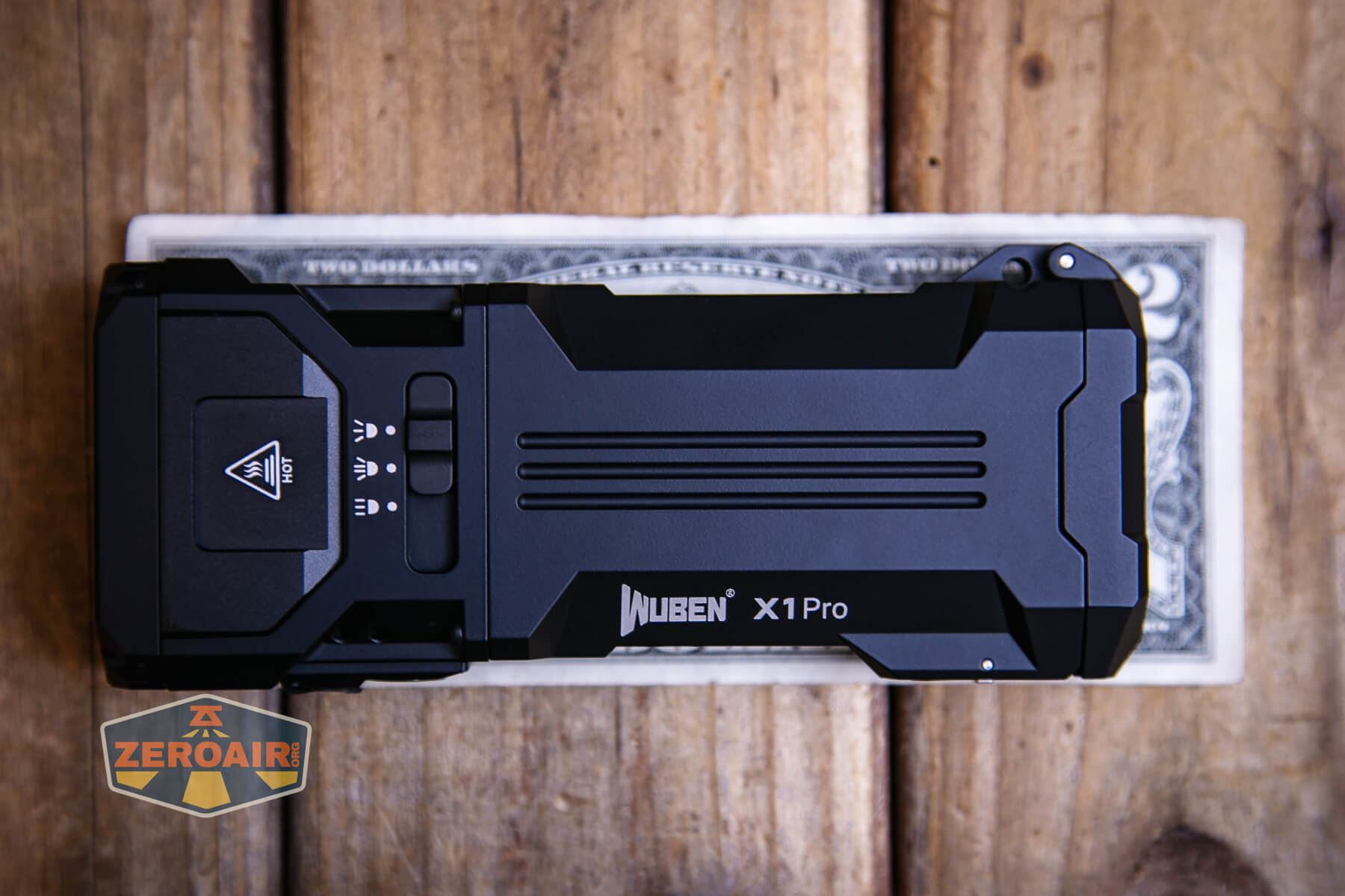 Wuben X1Pro Flashlight on two dollar bill