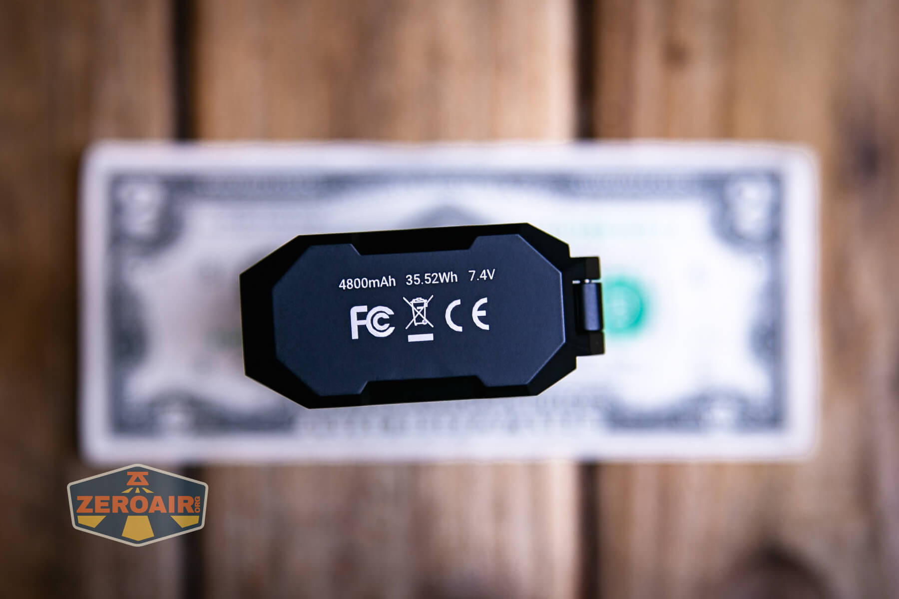 Wuben X1Pro Flashlight on two dollar bill