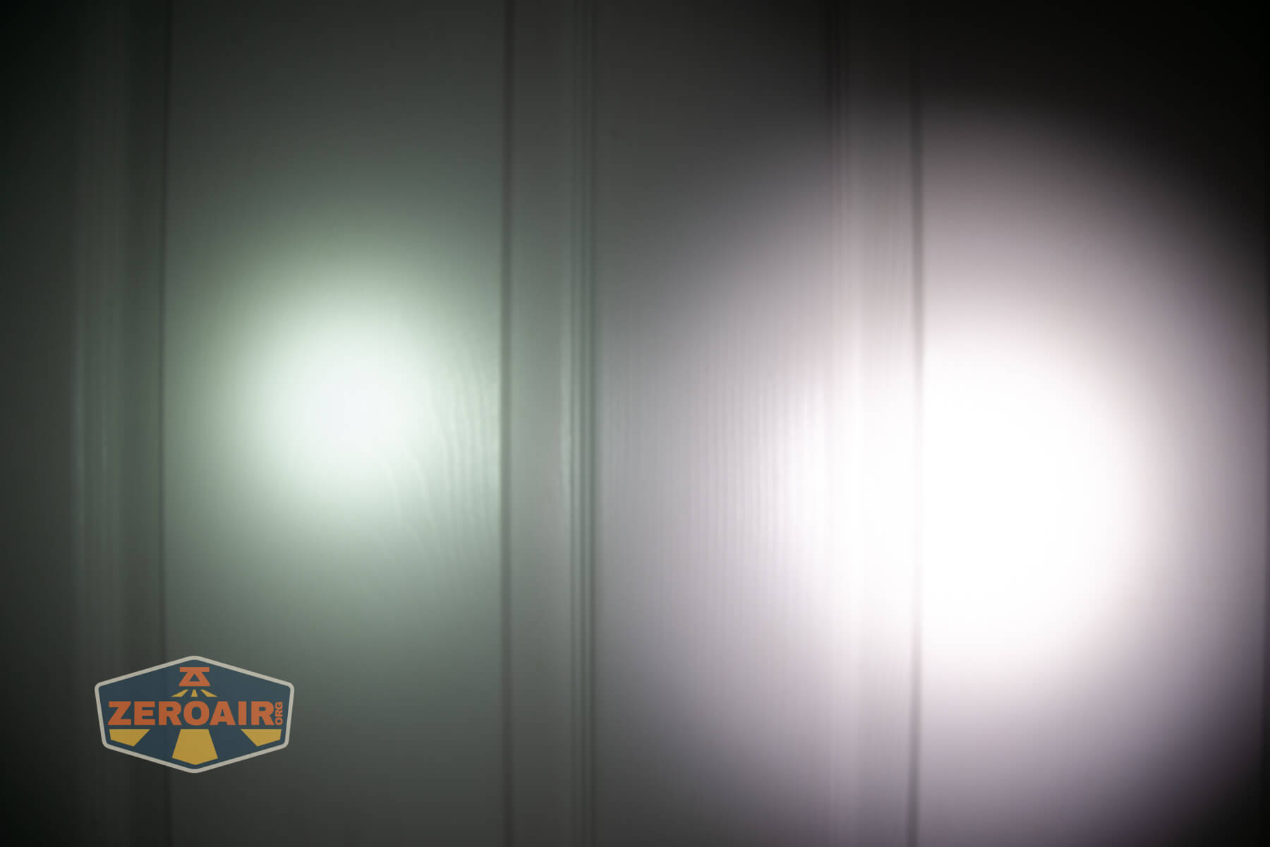 Wuben X1Pro Flashlight beamshots on door compared to Nichia 219b