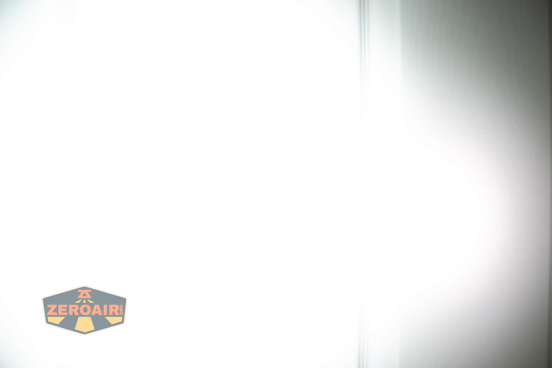 Wuben X1Pro Flashlight beamshots on door compared to Nichia 219b