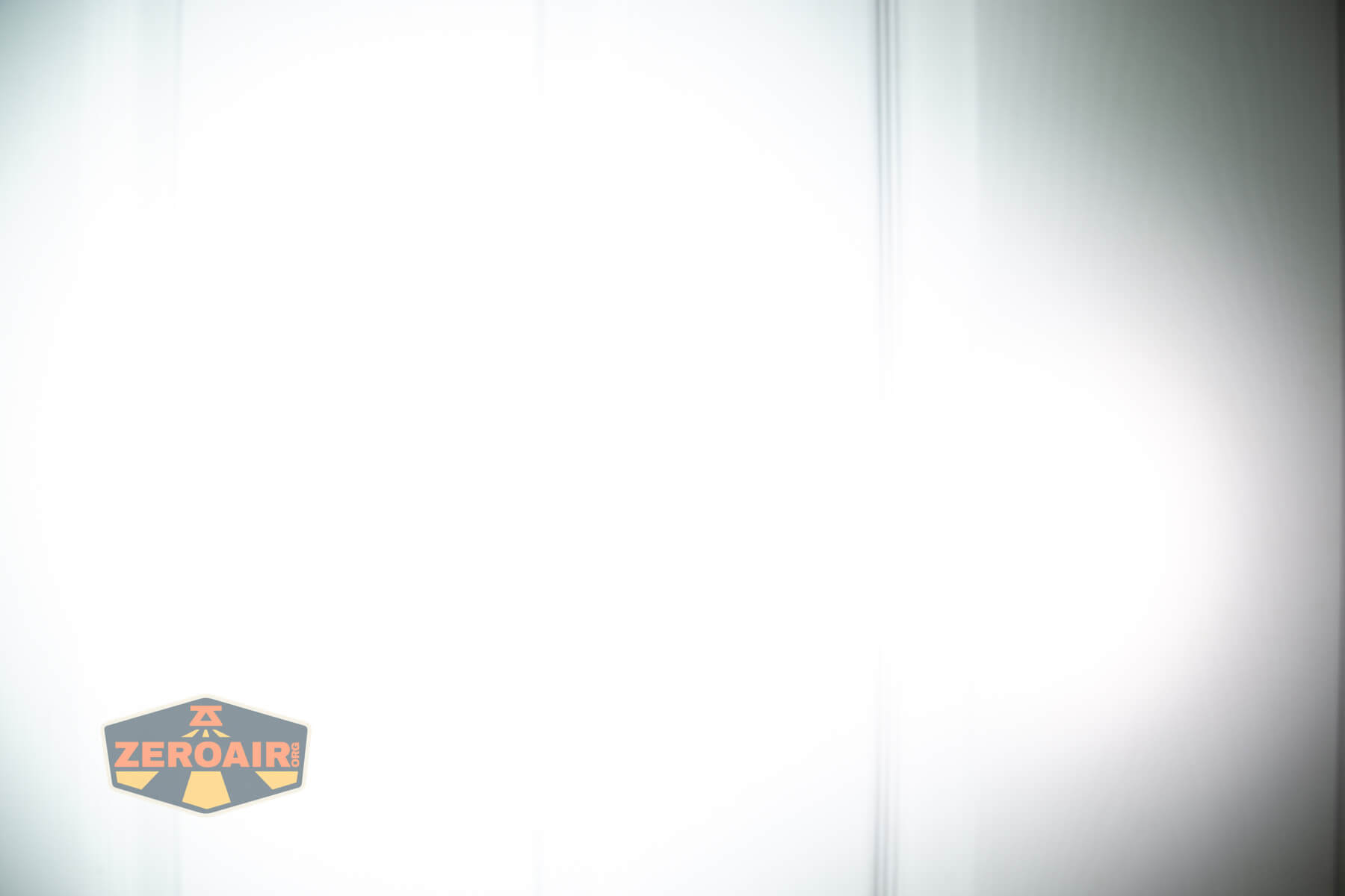 Wuben X1Pro Flashlight beamshots on door compared to Nichia 219b