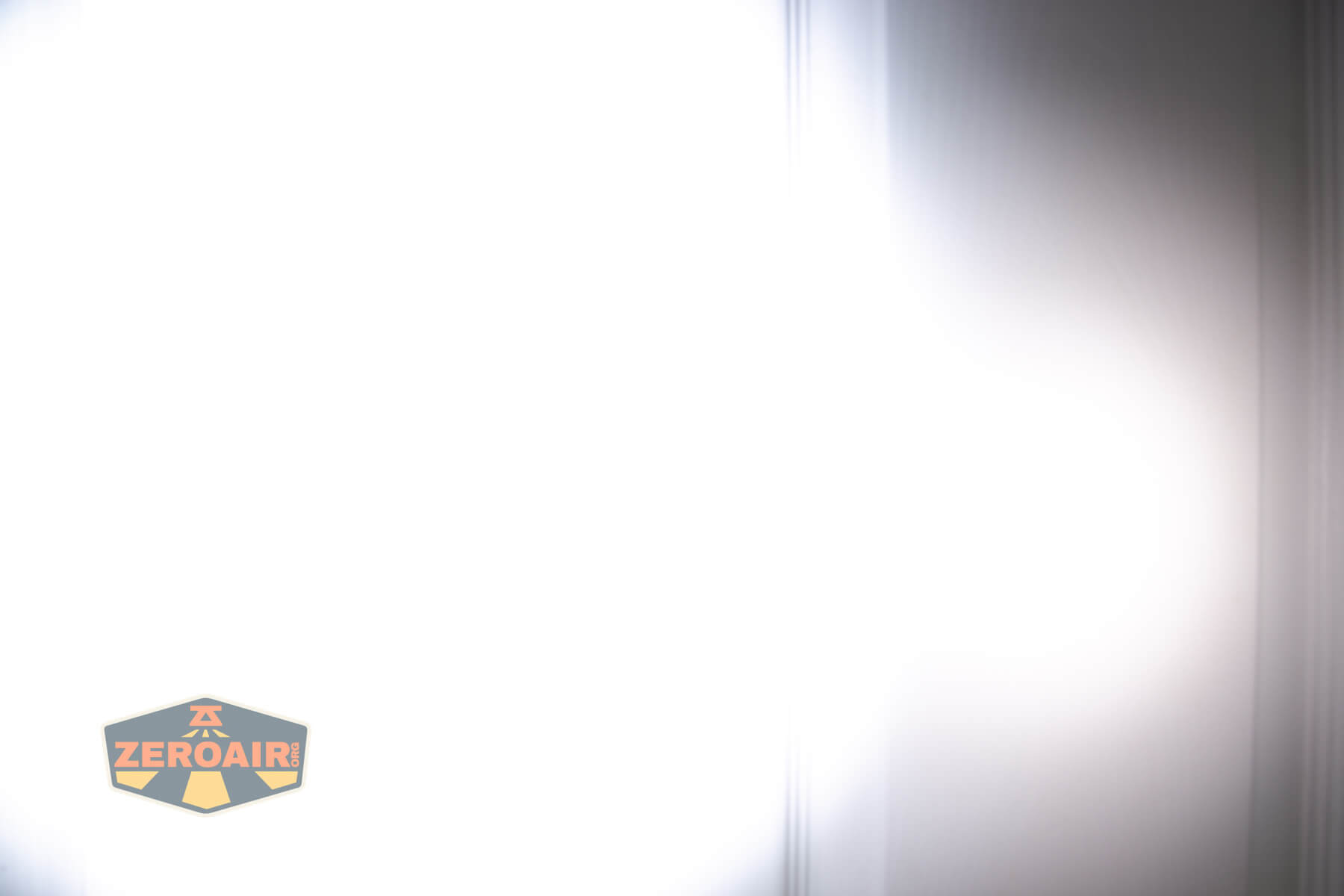 Nitecore EDC17 flat EDC flashlight beamshots on door compared to Nichia 219b