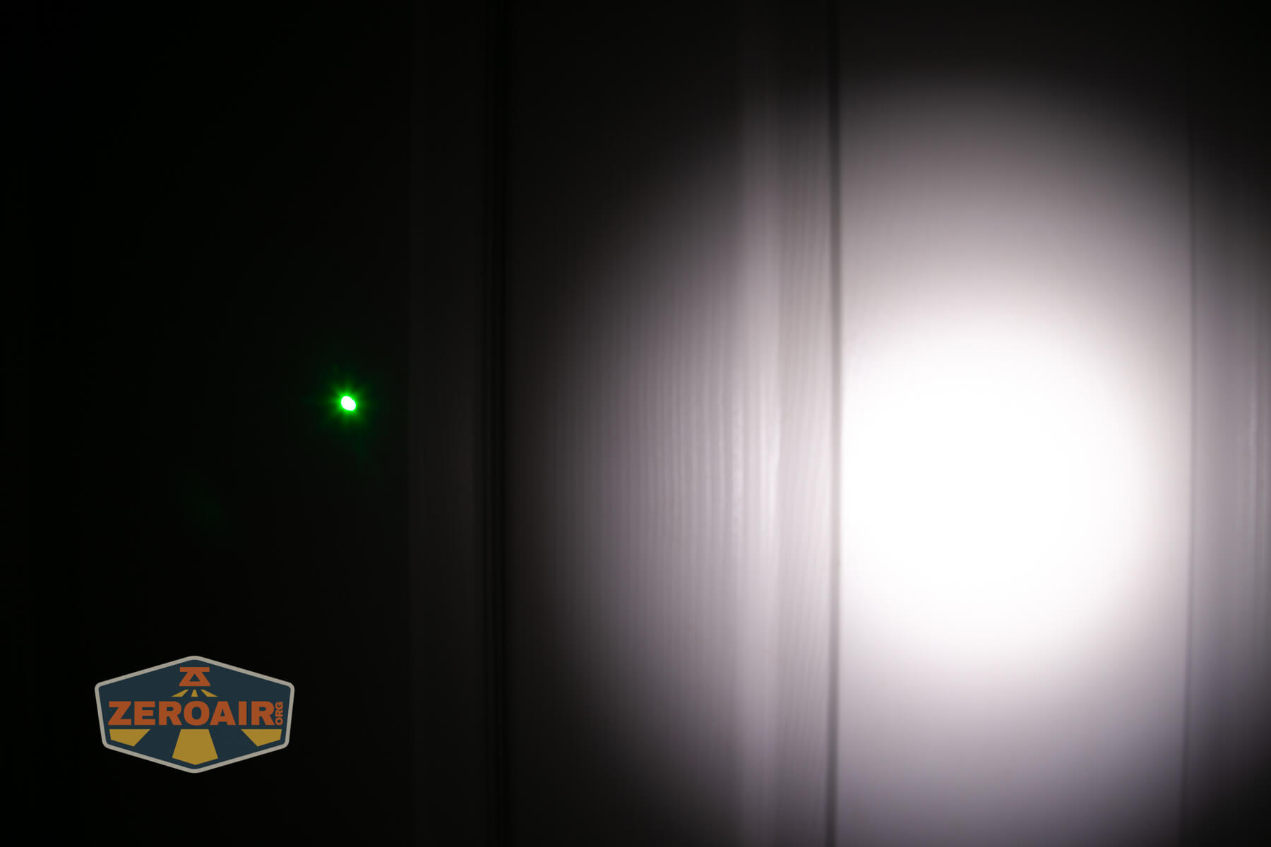 Nitecore EDC17 flat EDC flashlight beamshots on door compared to Nichia 219b