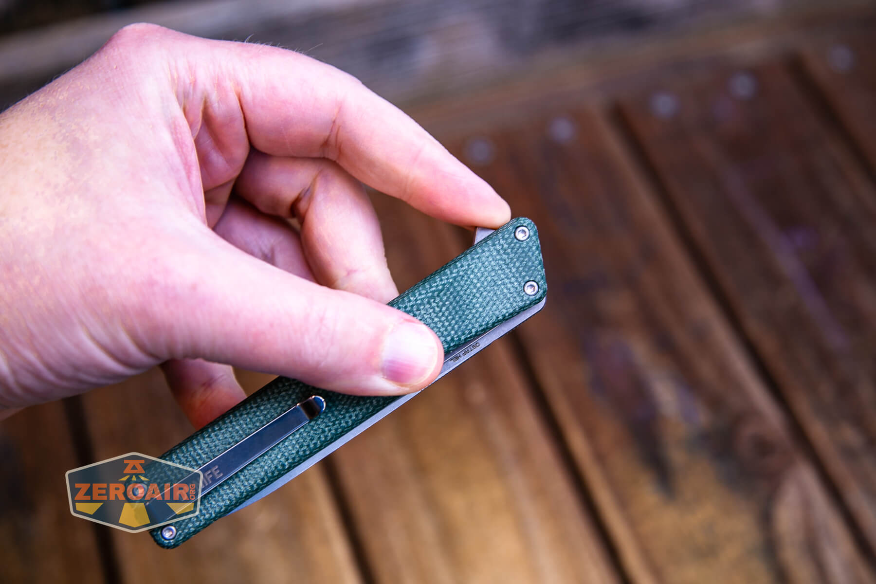 Oknife Aion Micarta Knife in hand flipper opening