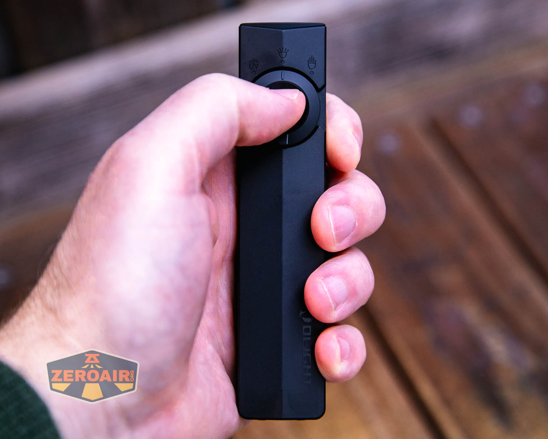 Olight ArkPro Matte Black cool white in hand