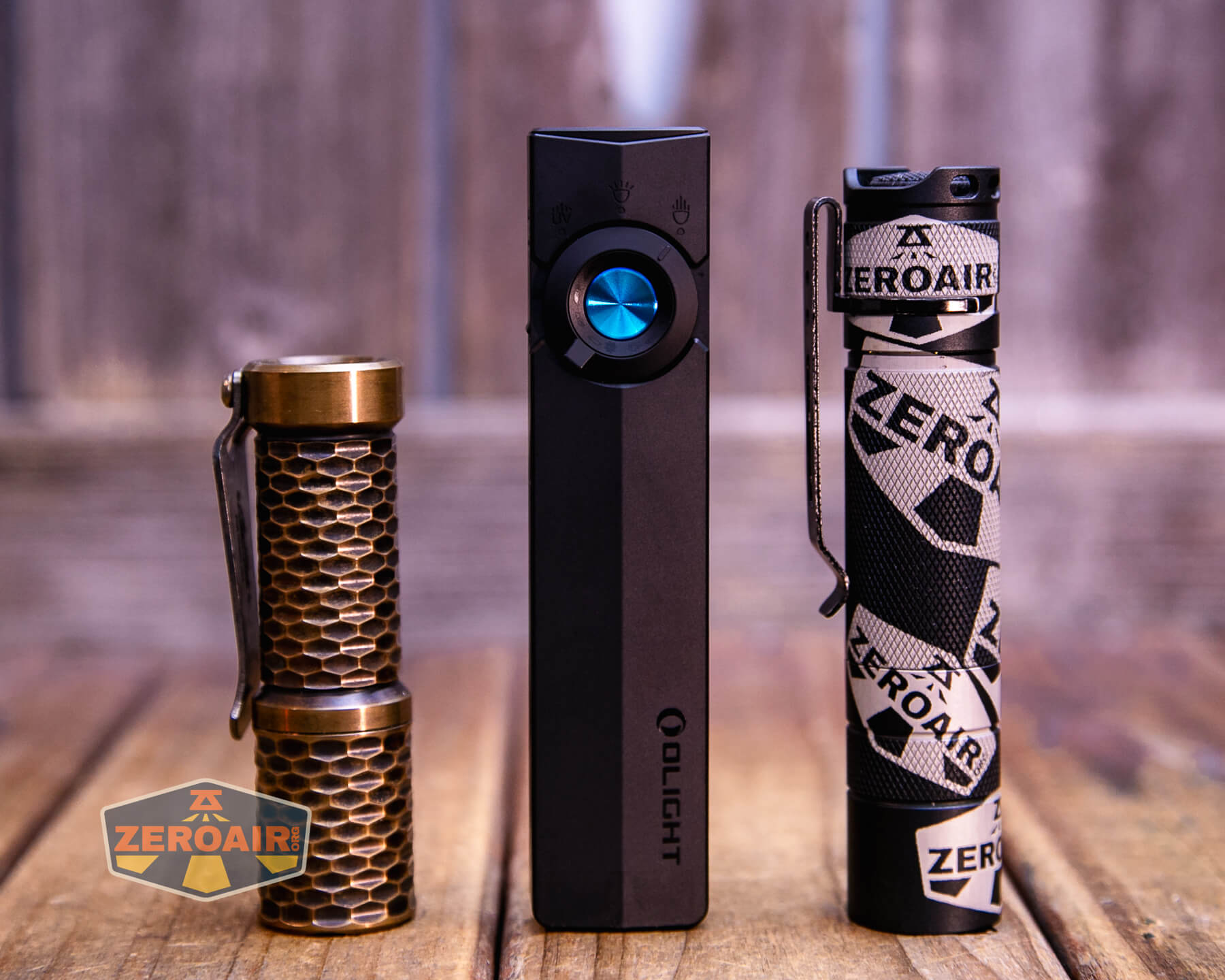 Olight ArkPro Matte Black cool white with standard-sized flashlights