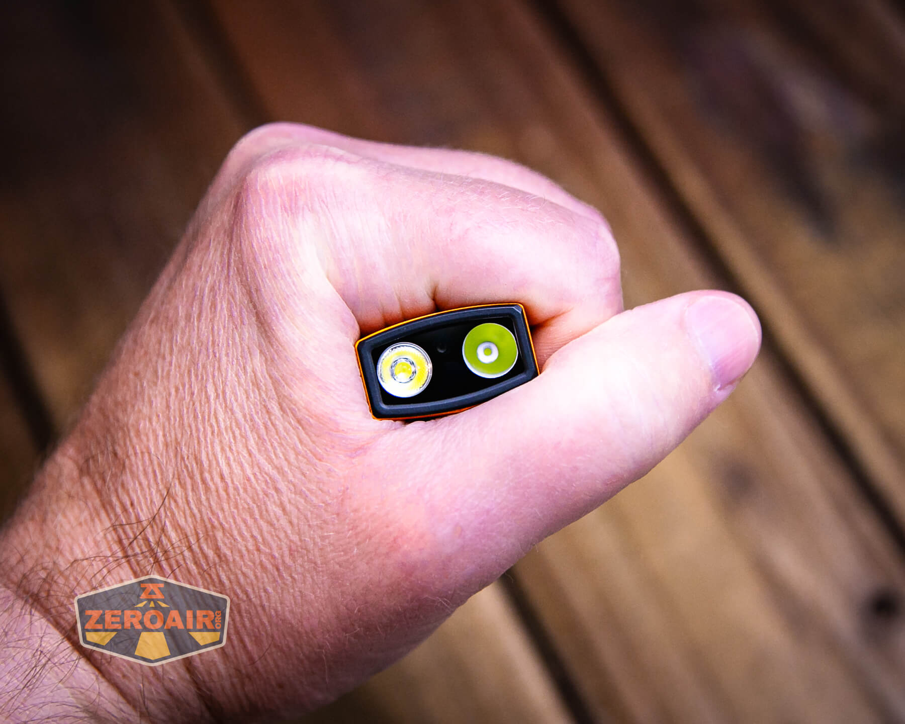 Olight ArkPro Orange flashlight in hand