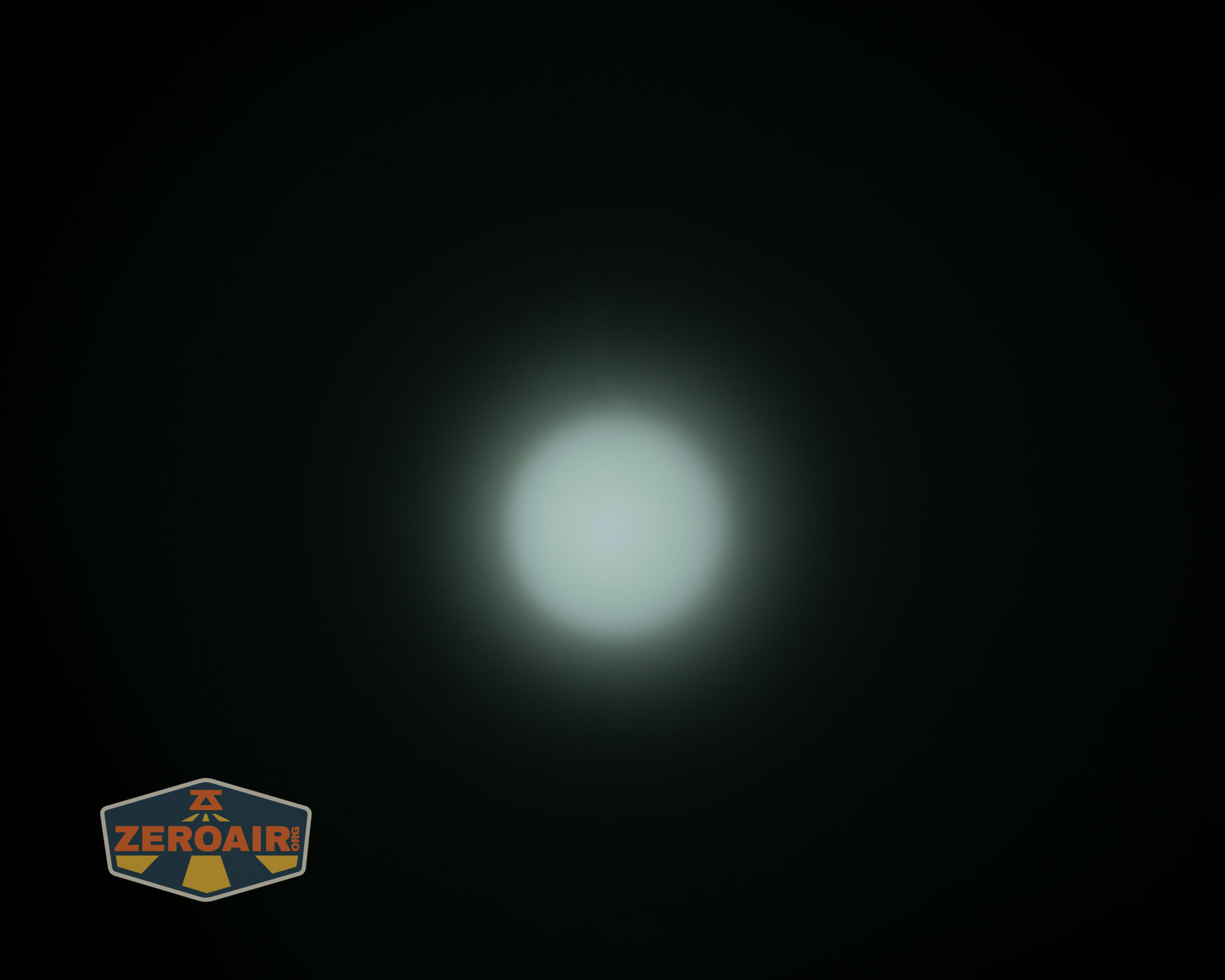 Olight ArkPro Orange flashlight beamshots on ceiling