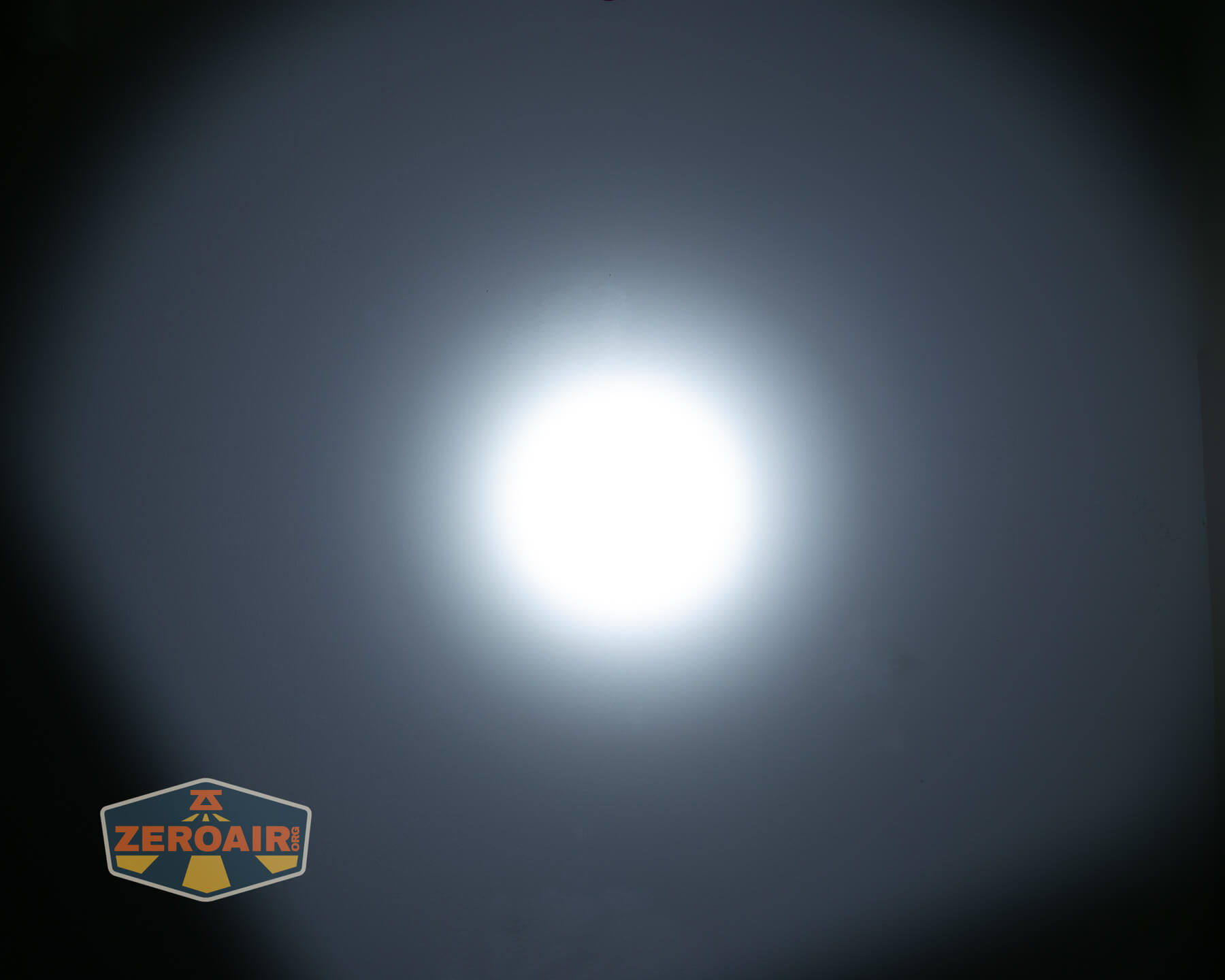 Olight ArkPro Orange flashlight beamshots on ceiling