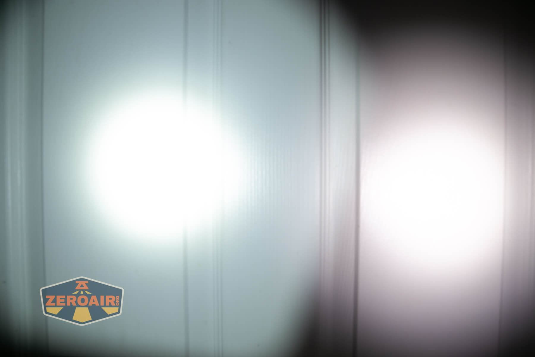 Olight ArkPro Orange flashlight beamshots compared to nichia 219b