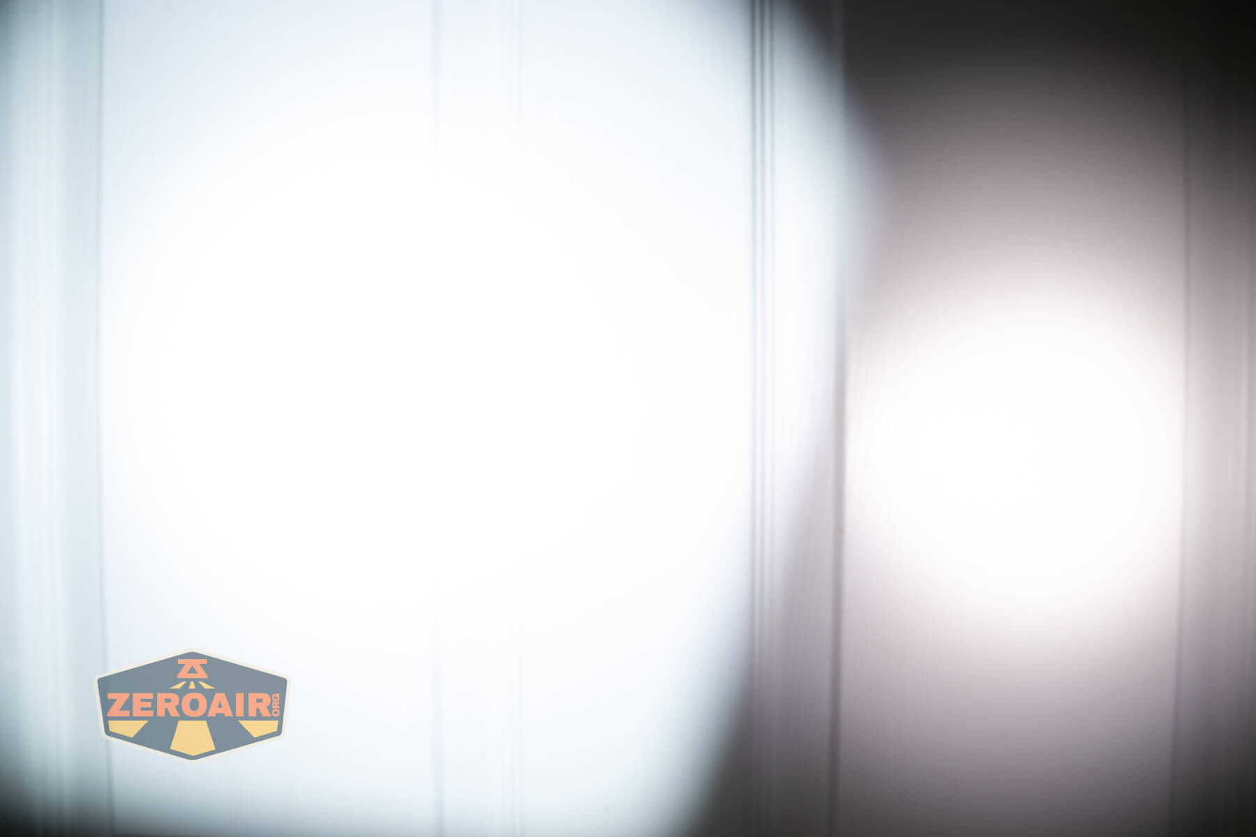 Olight ArkPro Orange flashlight beamshots compared to nichia 219b