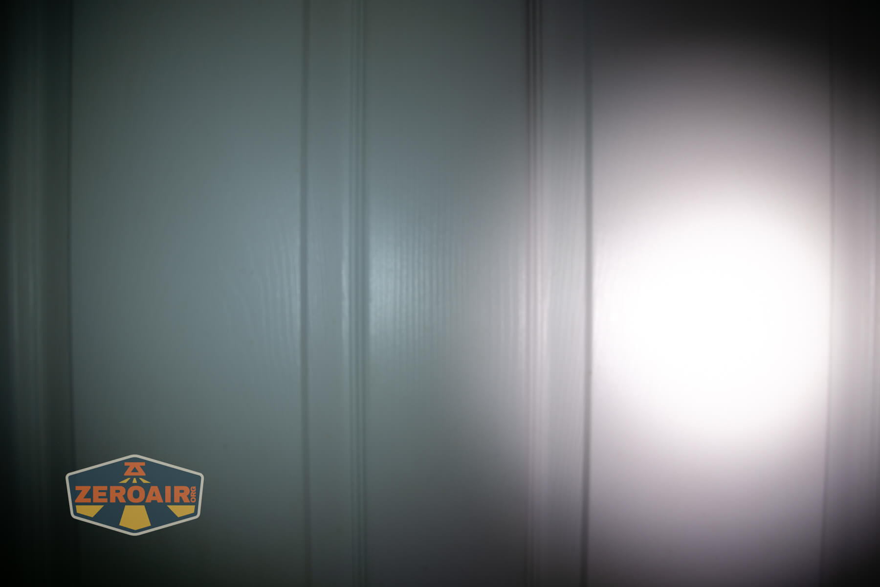 Olight ArkPro Orange flashlight beamshots compared to nichia 219b