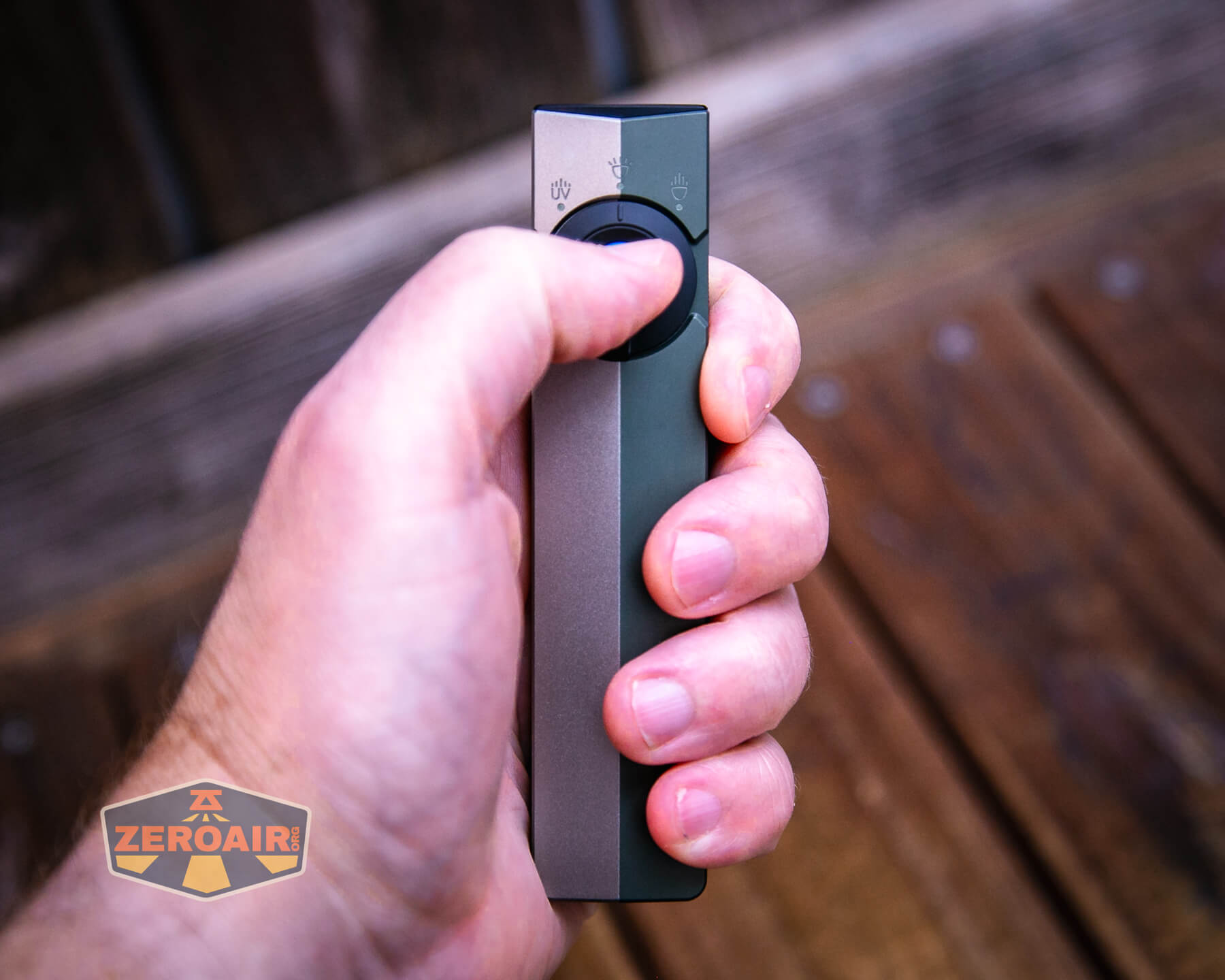 Olight ArkPro Silver flashlight in hand