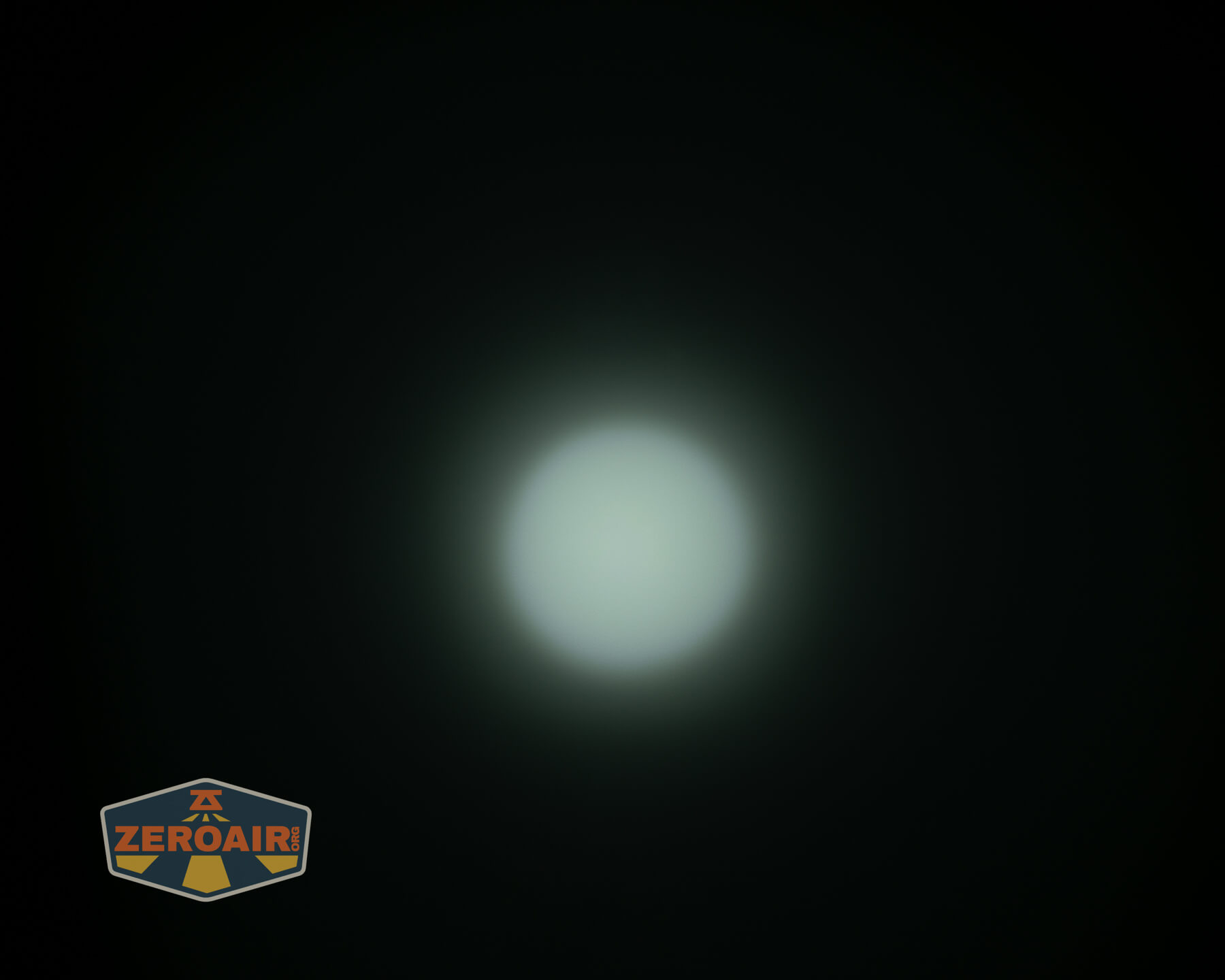 Olight ArkPro Silver flashlight beamshots on ceiling