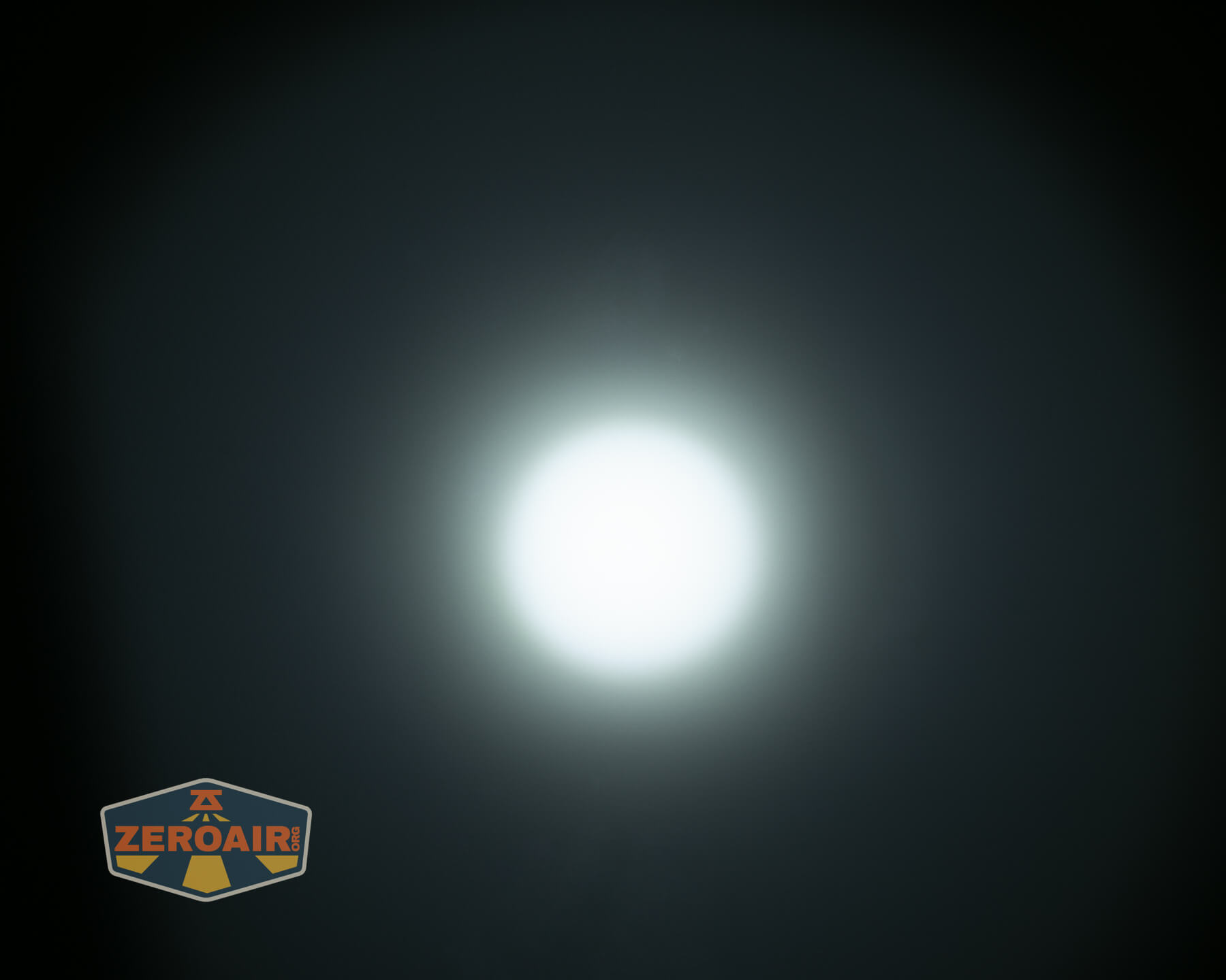 Olight ArkPro Silver flashlight beamshots on ceiling