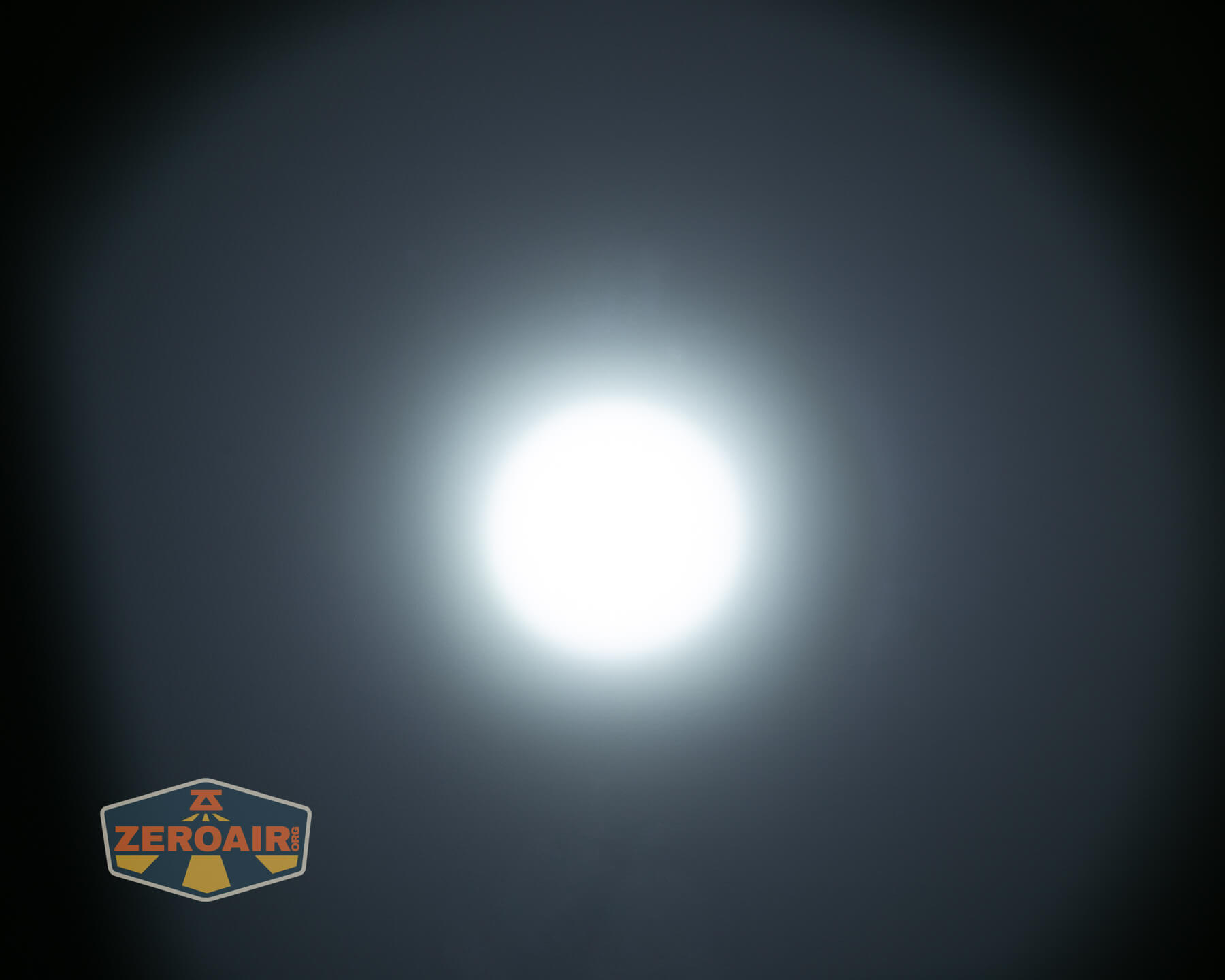 Olight ArkPro Silver flashlight beamshots on ceiling