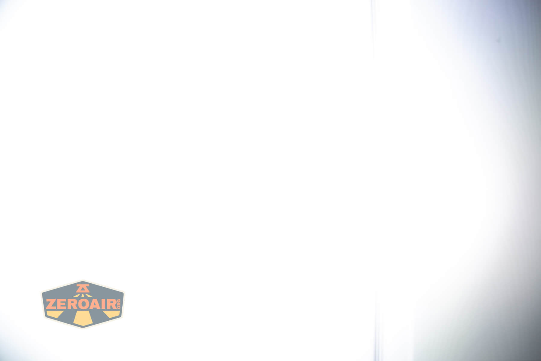 Olight ArkPro Silver flashlight beamshots on door compared to nichia 219b