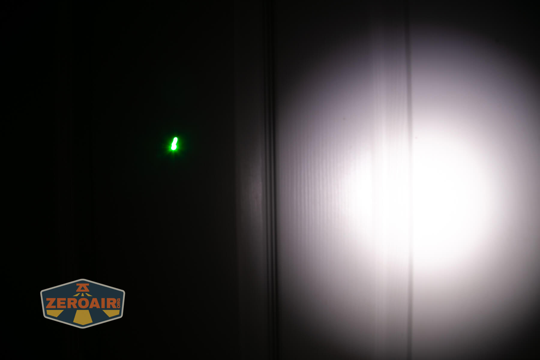 Olight ArkPro Silver flashlight laser beamshots on door compared to nichia 219b