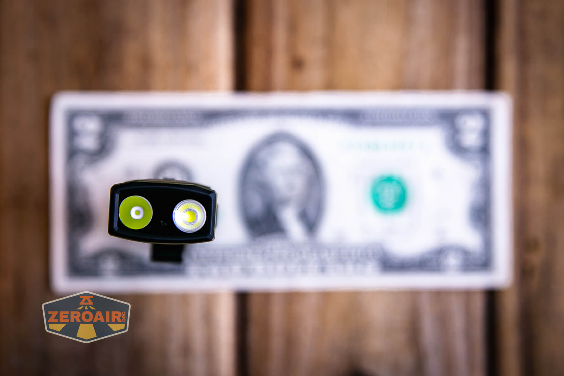 Olight ArkPro Ultra flat edc flashlight on two dollar bill