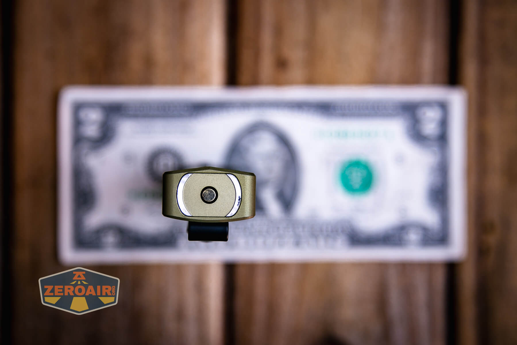 Olight ArkPro Ultra flat edc flashlight on two dollar bill