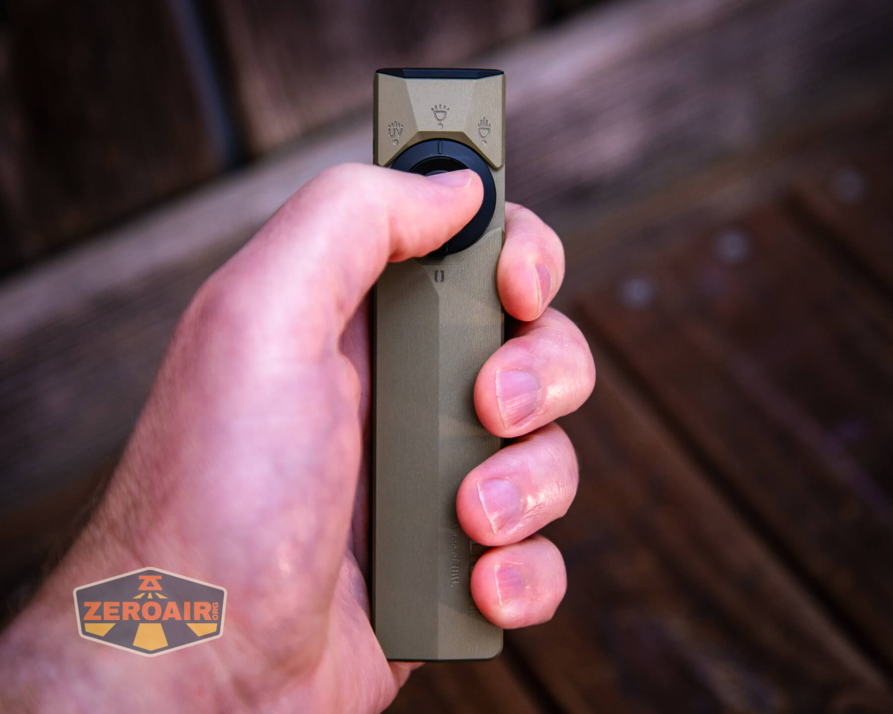Olight ArkPro Ultra flat edc flashlight in hand