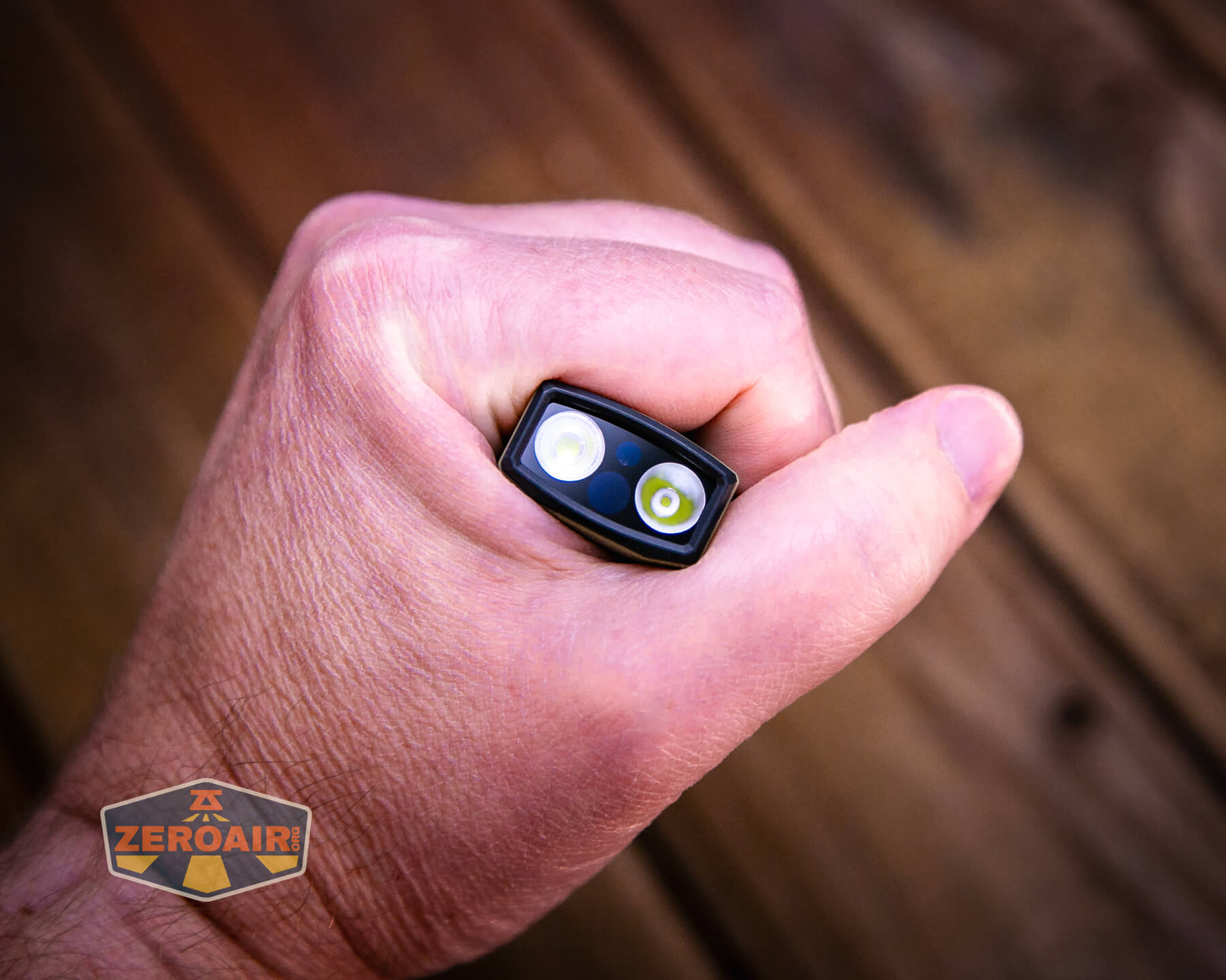 Olight ArkPro Ultra flat edc flashlight in hand