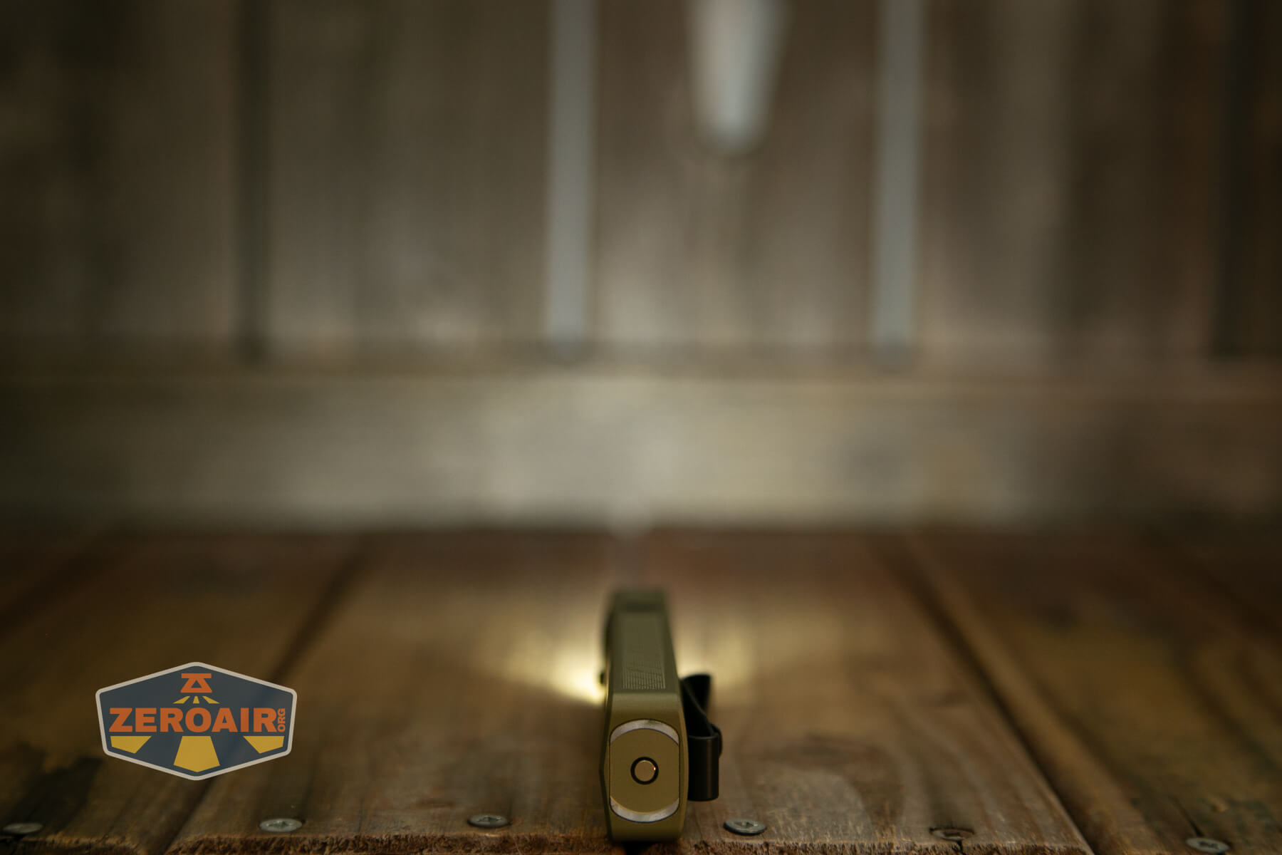 Olight ArkPro Ultra flat EDC flashlight emitter on