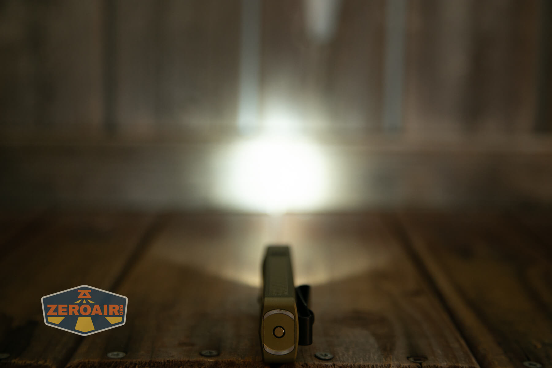 Olight ArkPro Ultra flat EDC flashlight emitter on