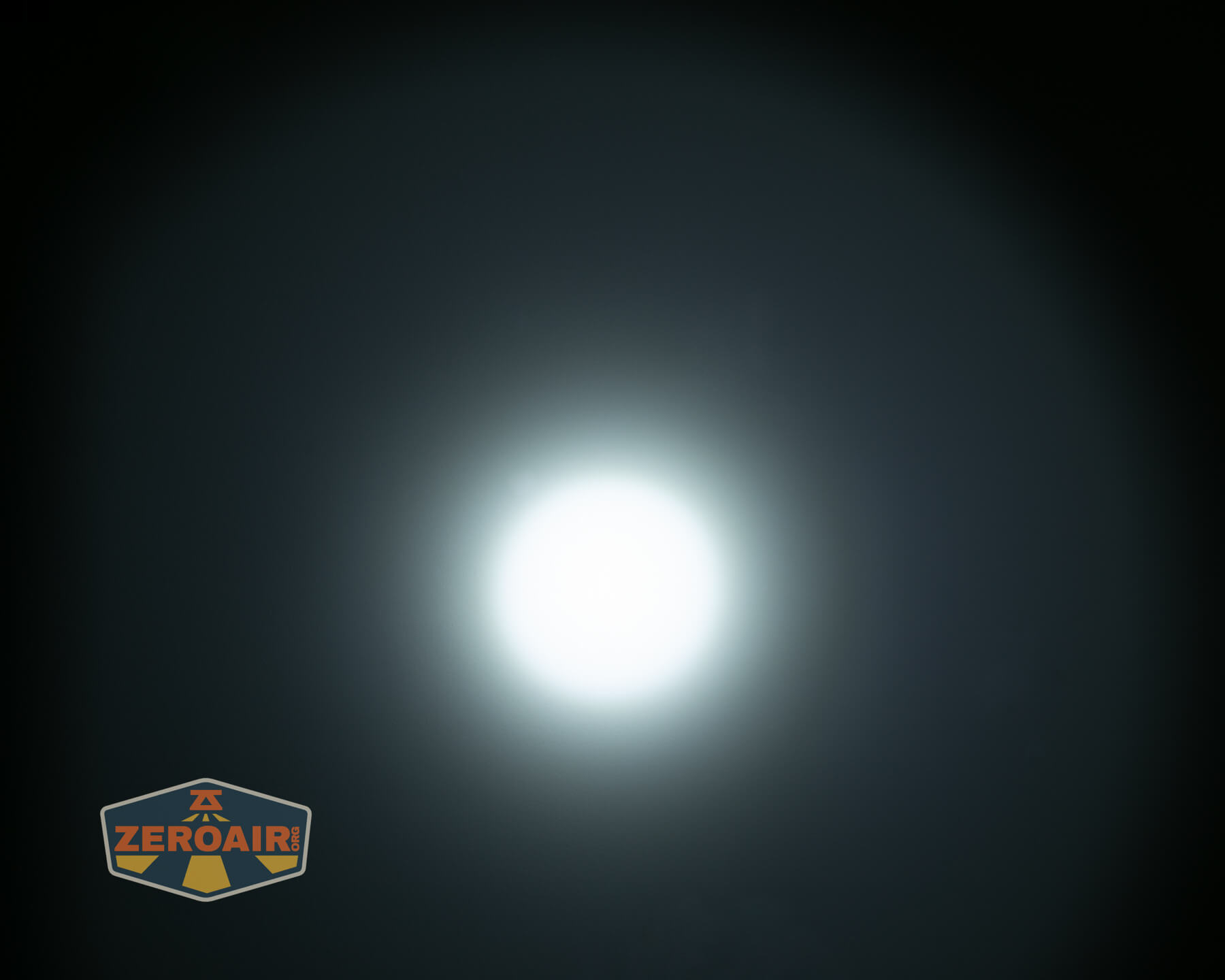 Olight ArkPro Ultra flat EDC flashlight beamshots on ceiling