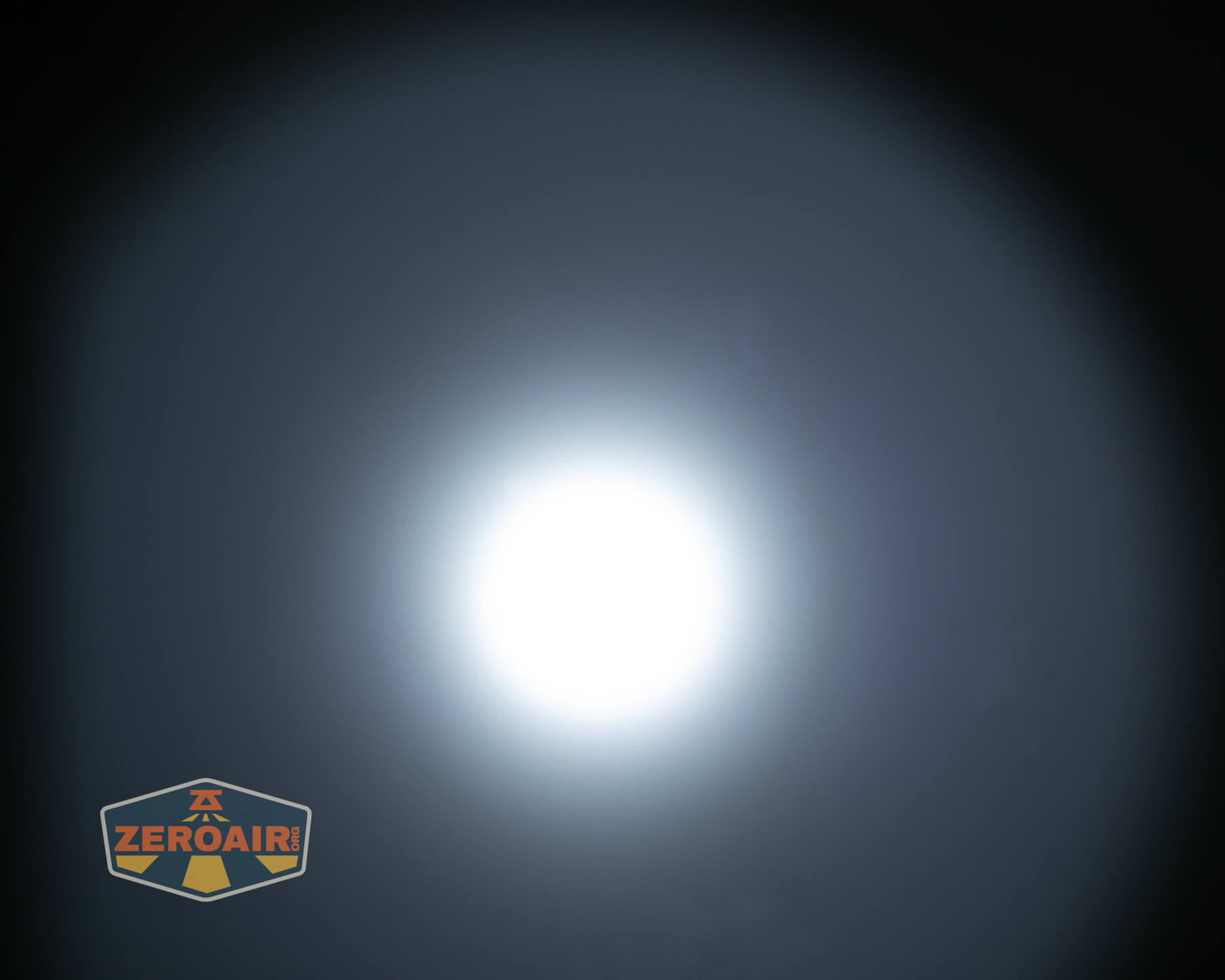 Olight ArkPro Ultra flat EDC flashlight beamshots on ceiling