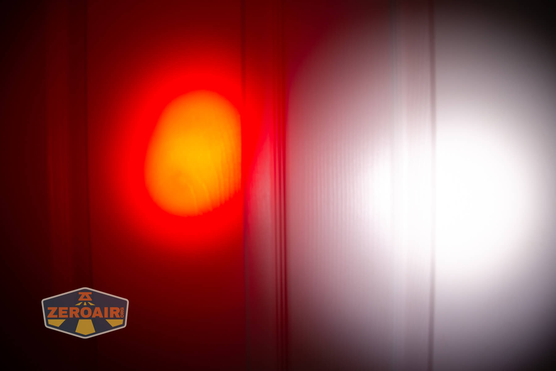 Olight Marauder Mini 2 Compact powerful flashlight beamshots on door compared to nichia 219b