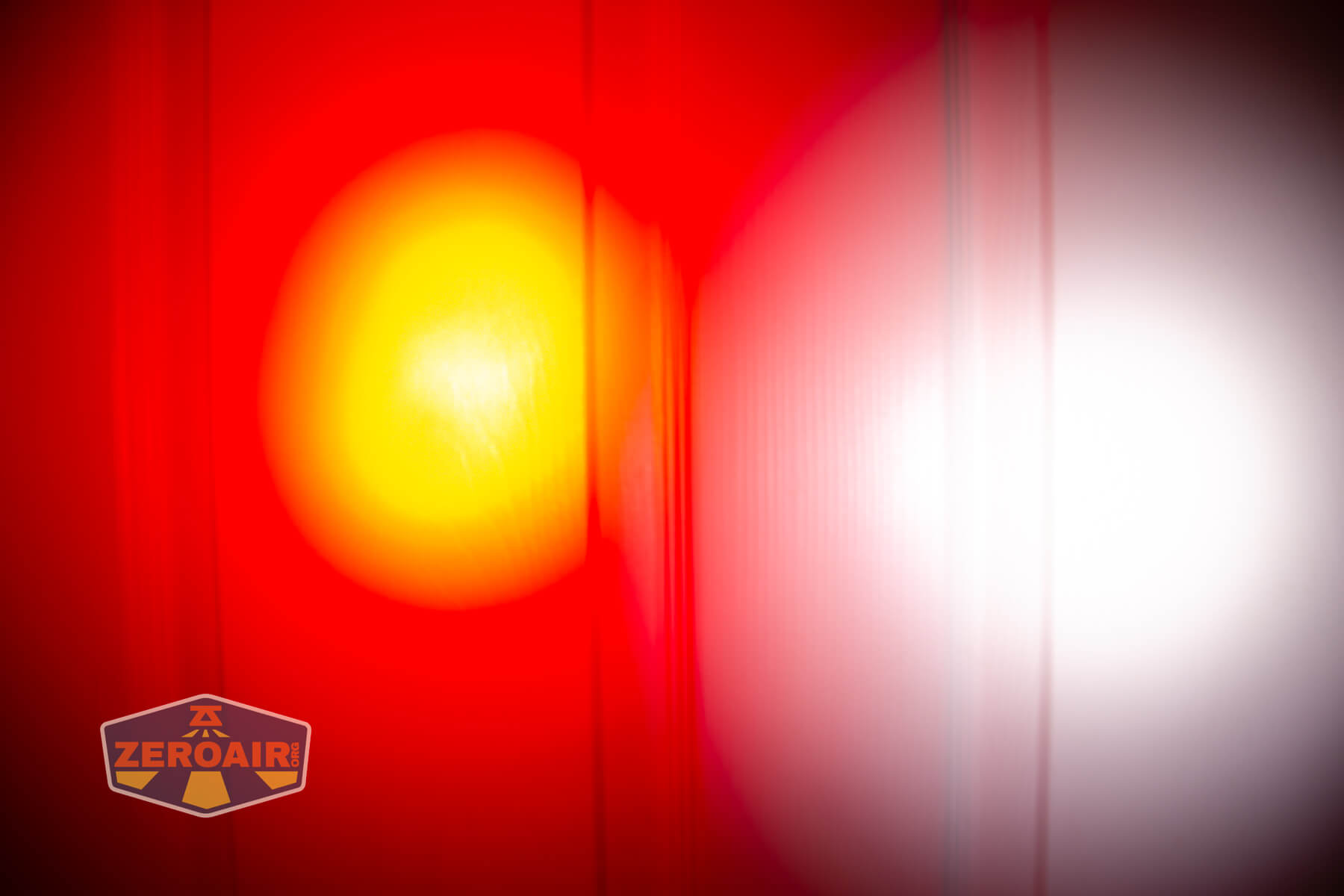 Olight Marauder Mini 2 Compact powerful flashlight beamshots on door compared to nichia 219b