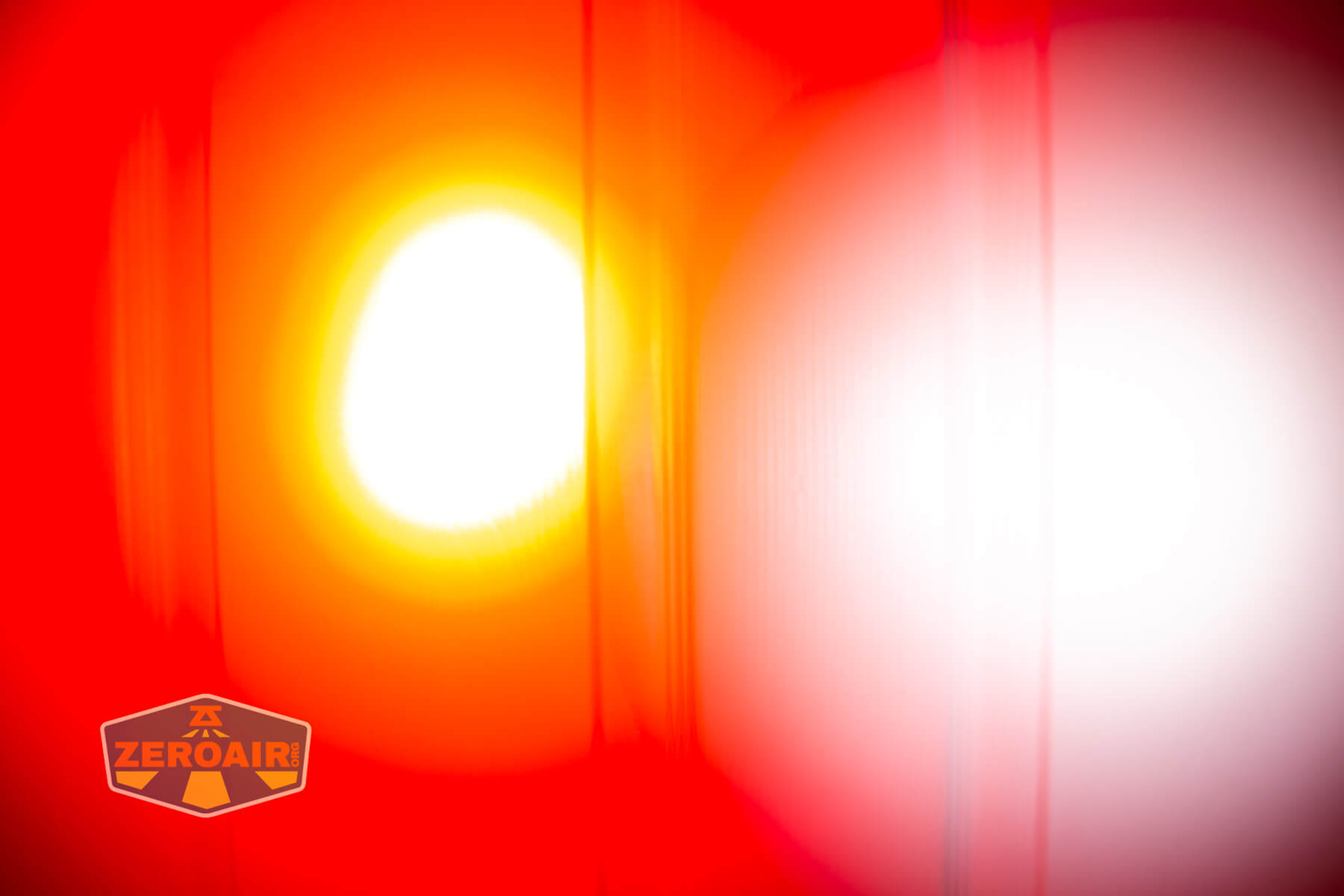 Olight Marauder Mini 2 Compact powerful flashlight beamshots on door compared to nichia 219b