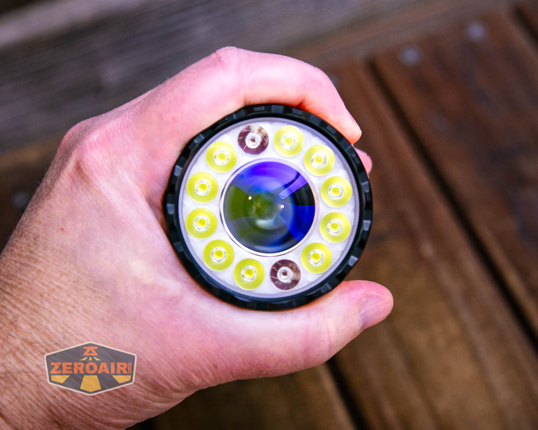 Olight Marauder Mini 2 Compact powerful flashlight in hand