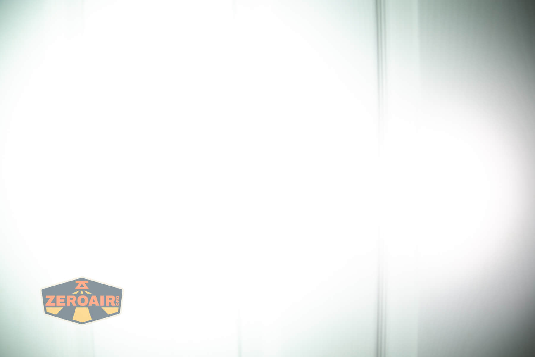 Olight Marauder Mini 2 Compact powerful flashlight beamshots on door compared to nichia 219b