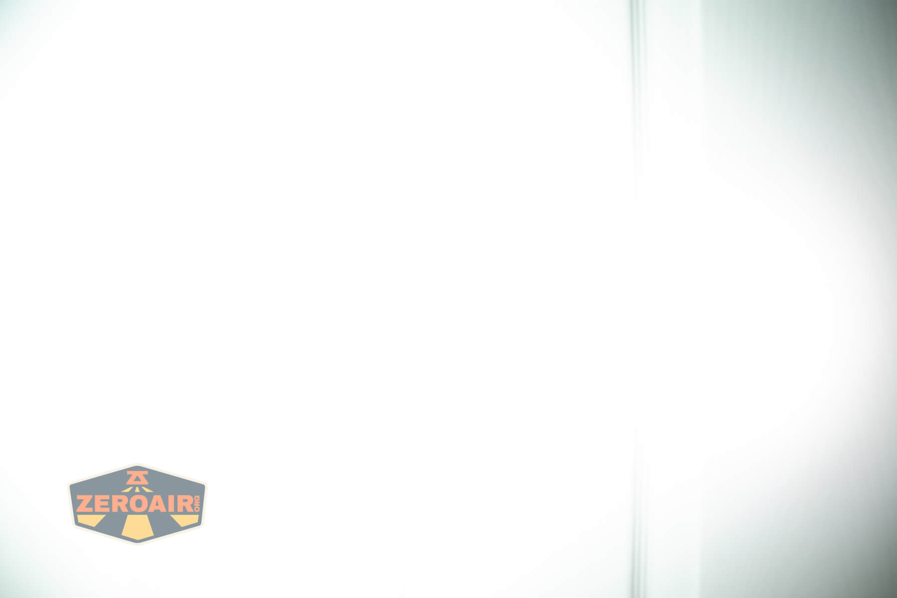 Olight Marauder Mini 2 Compact powerful flashlight beamshots on door compared to nichia 219b