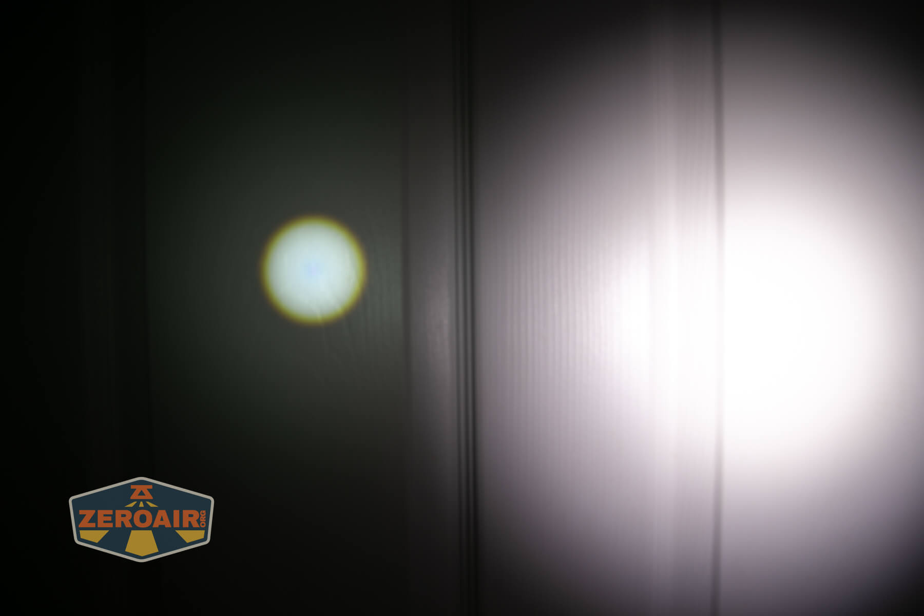 Olight Marauder Mini 2 Compact powerful flashlight beamshots on door compared to nichia 219b