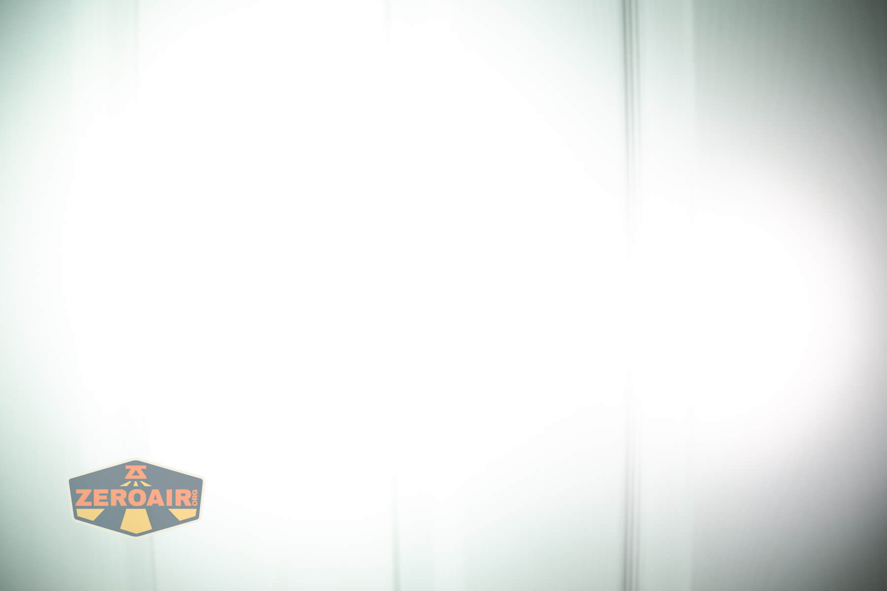 Olight Marauder Mini 2 Compact powerful flashlight beamshots on door compared to nichia 219b