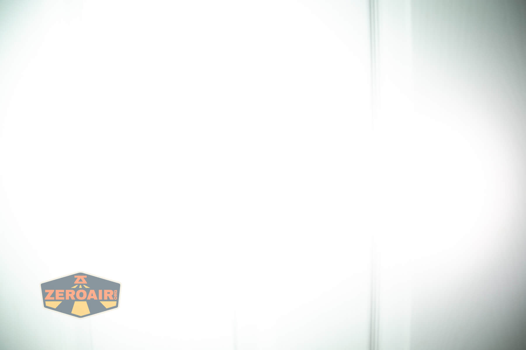 Olight Marauder Mini 2 Compact powerful flashlight beamshots on door compared to nichia 219b