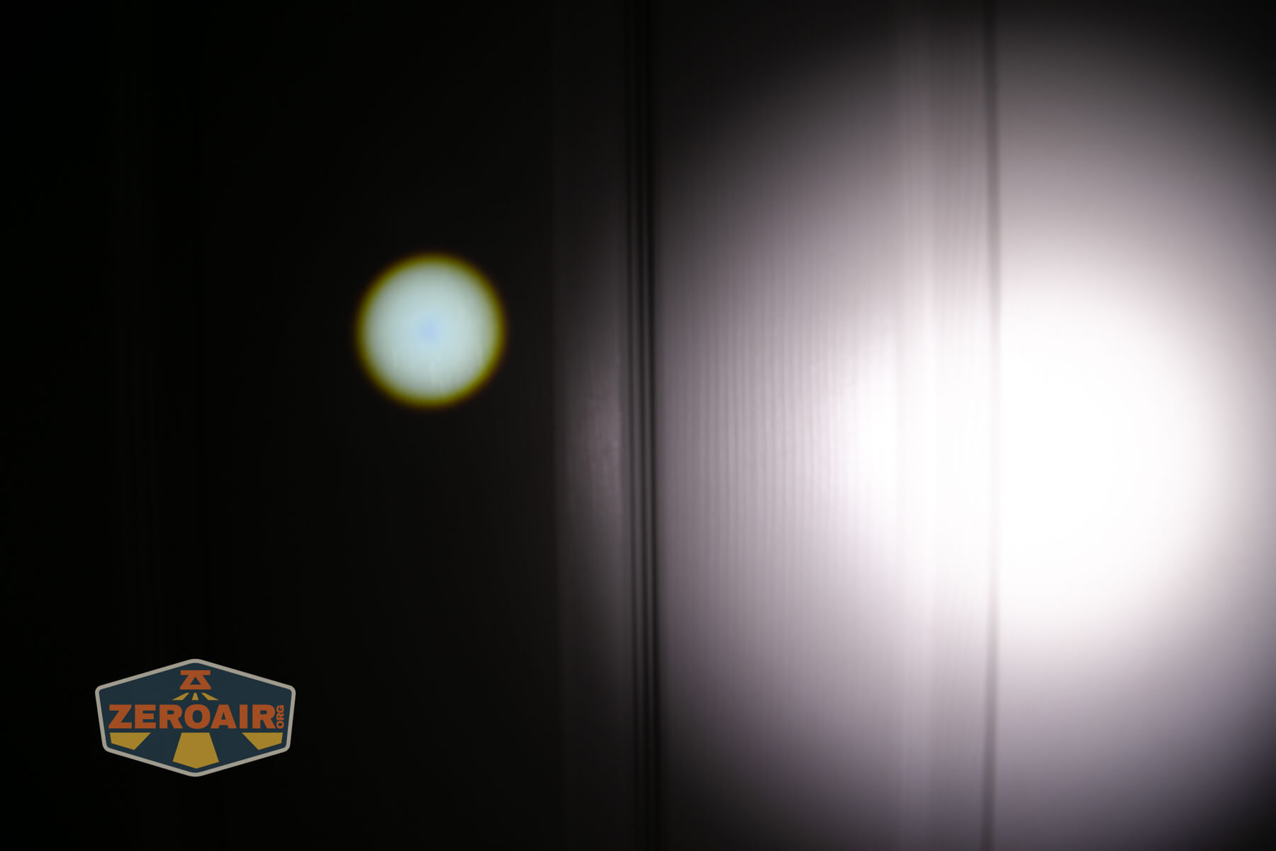Olight Marauder Mini 2 Compact powerful flashlight beamshots on door compared to nichia 219b