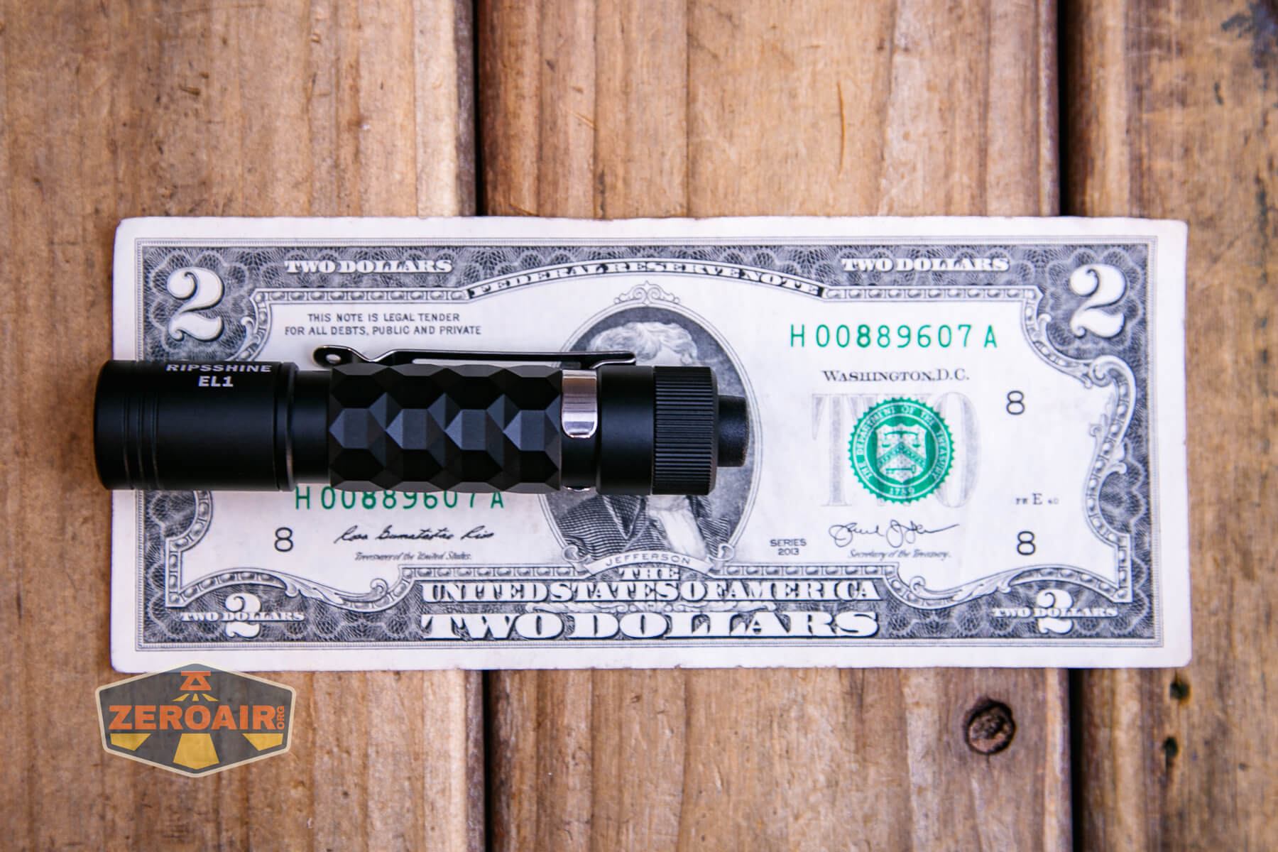 Ripshine EL1 14500 flashlight on two dollar bill
