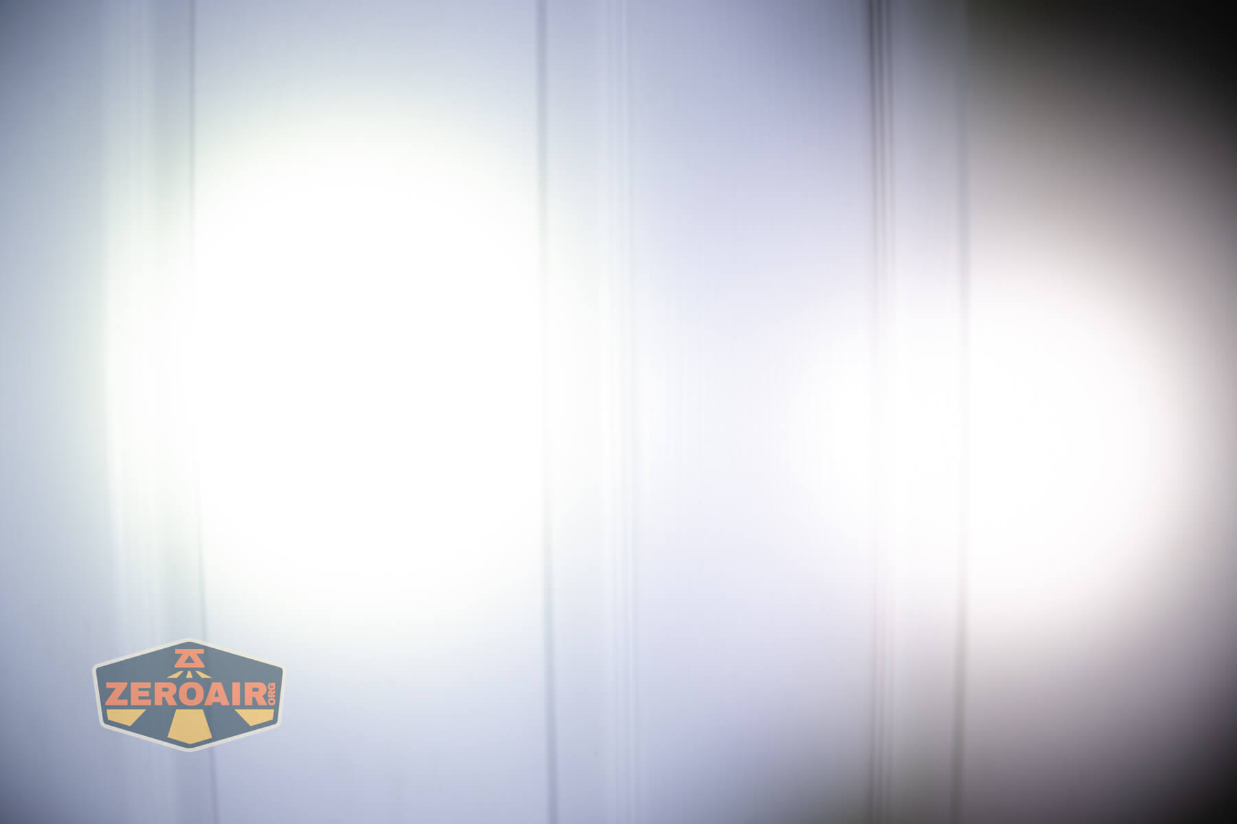 Ripshine EL1 14500 flashlight beamshots on door compared to nichia 219b